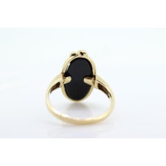 14k ONYX and diamond ring. Oval Onyx bezel set with tiny diamonds mourning ring