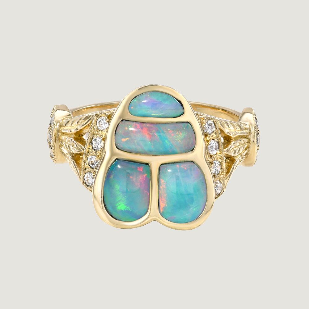 14k Opal Egyptian Scarab Ring with Diamonds 

OPAL SCARAB LOTUS RING

The Scarab is an ancient symbol found on some of the most highest Queens and Pharaohs in Egypt. They symbolize star wisdom of the cosmos. Scarabs travel across the desert always