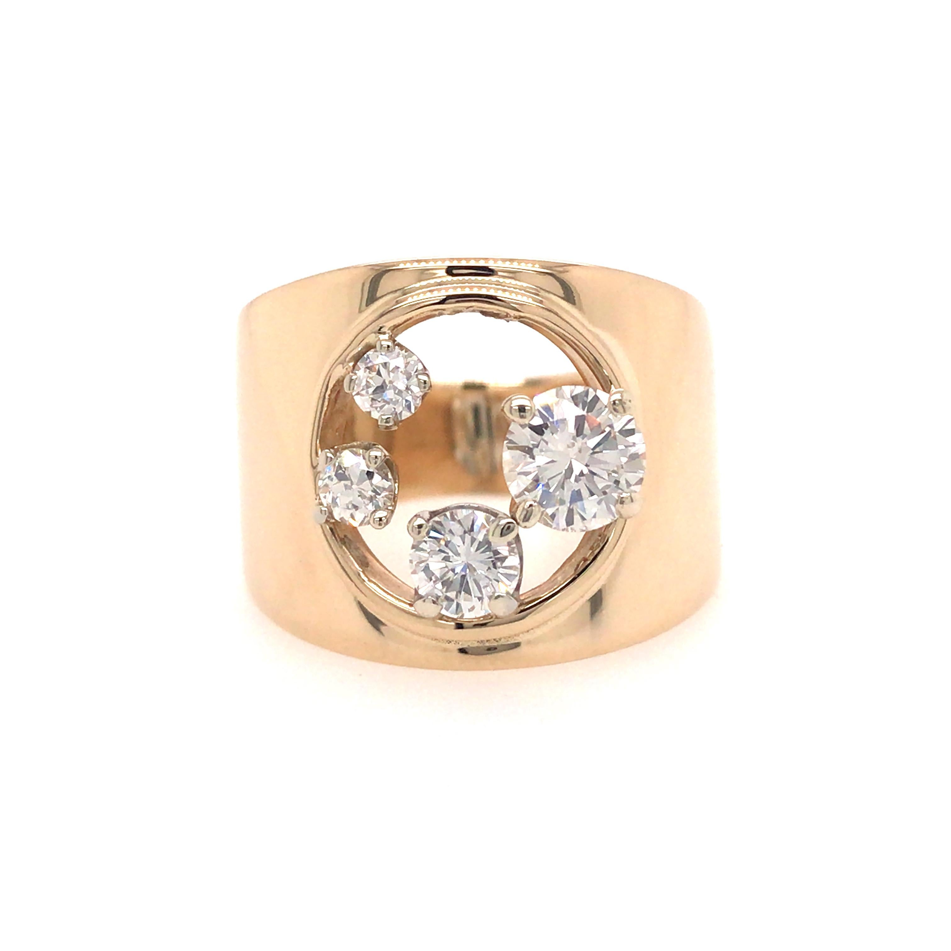 Open Space Diamond Band in 14K Yellow Gold.  (4) Round Brilliant Cut Diamonds weighing 1.10 carat total weight G-H in color and VS-SI in clarity are expertly set.  The Ring measures 5/8 inch in width at the widest point.  Ring size 7. 10.26 grams.