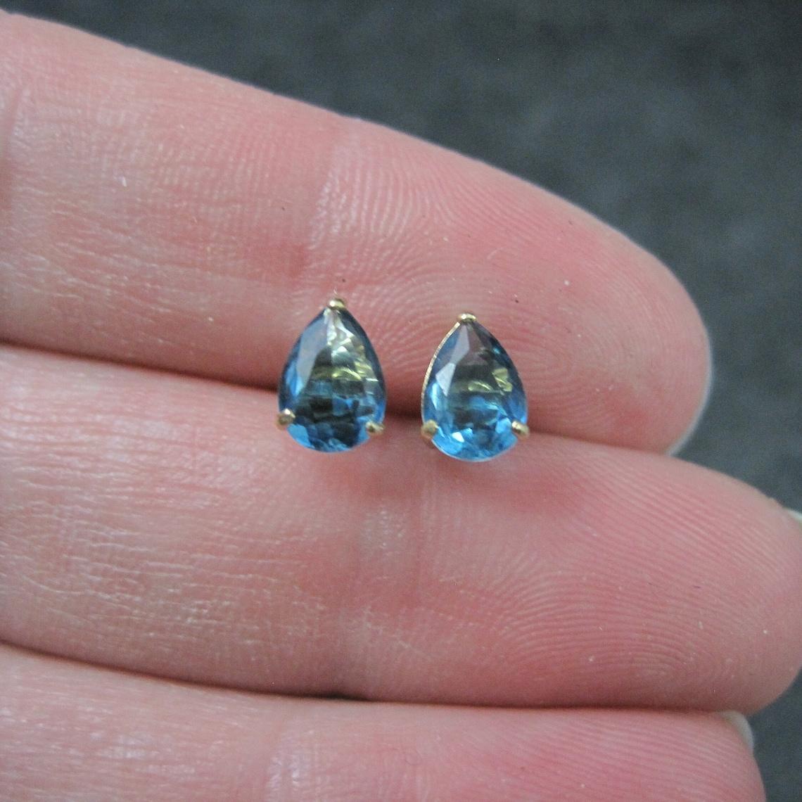 These gorgeous estate stud earrings are 14k yellow gold.
They feature 5x7mm pear cut genuine blue zircon gemstones.

Marks: 14K
Condition: Excellent
These earrings have been steam cleaned and sanitized. They are non returnable.