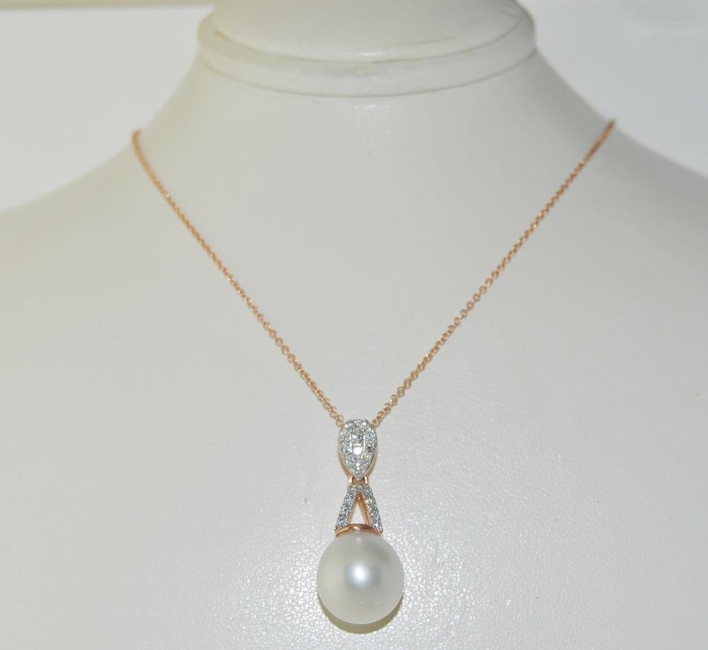Pendant Necklace featuring 10.00mm White South Sea Pearl and 0.27 carats of brilliant round white diamonds.  This pendant is mounted in 14K rose gold with 18 inches chain.  Pendant length 1 inch.