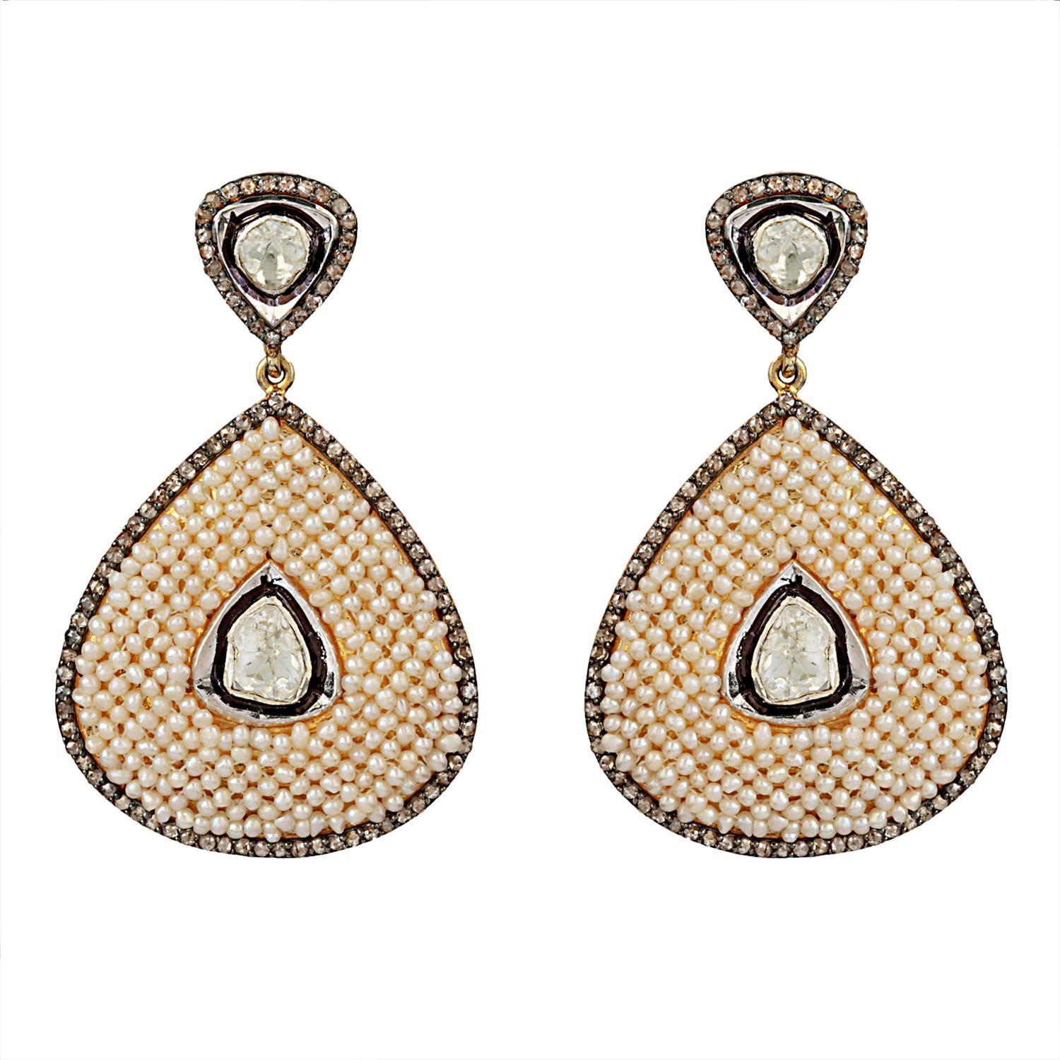 Pearl Drop Dangle Silver Earring with Diamond 2.40 carat. Total Gross weight Of the drop dangle earring worth 19.300 grams with 14k polished gold 0.290 grams and 925 sterling silver worth 16.31 grams. Pearls with 11.10 carats.

Pearl helps in curing