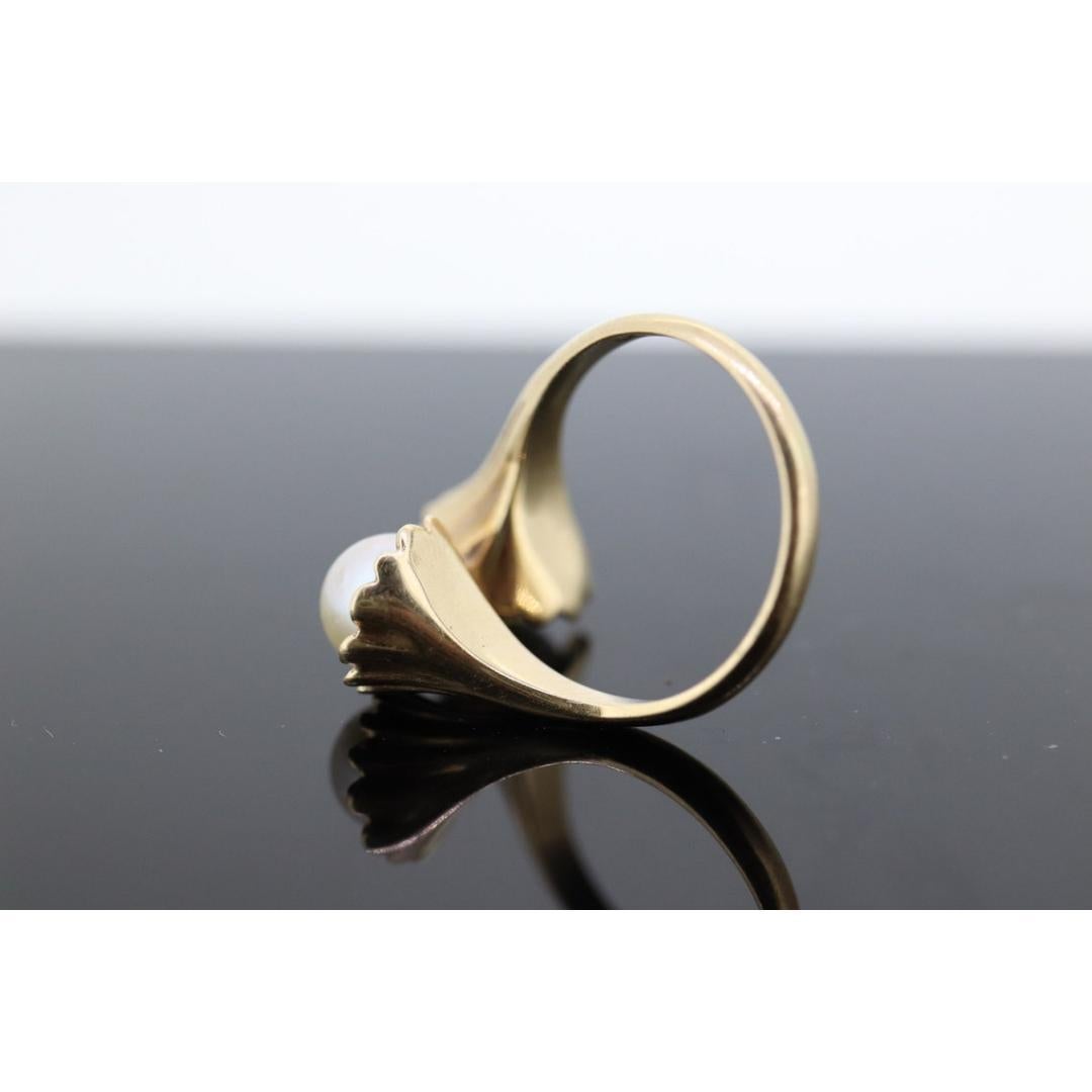 Vintage from the 1980s
Size: 6 US
Materials: Stone
Gemstone: Pearl
Gem color: White
Band color: Gold

Style: Minimalist

About this item

Extraordinary Pearl Ring. Akoya pearls set in floral funnels. All in 14k Yellow Gold. Wrap around finger