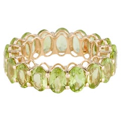 14K Peridot Eternity Band Ring - Size 7, Timeless Style, Vibrant Green Gemstones