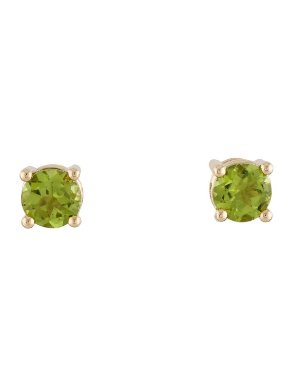 This stunning pair of stud earrings exudes elegance and charm, crafted in lustrous 14K yellow gold. Adorning each earring is a vibrant round brilliant peridot, totaling 2.66 carats, adding a touch of natural beauty and sophistication to any