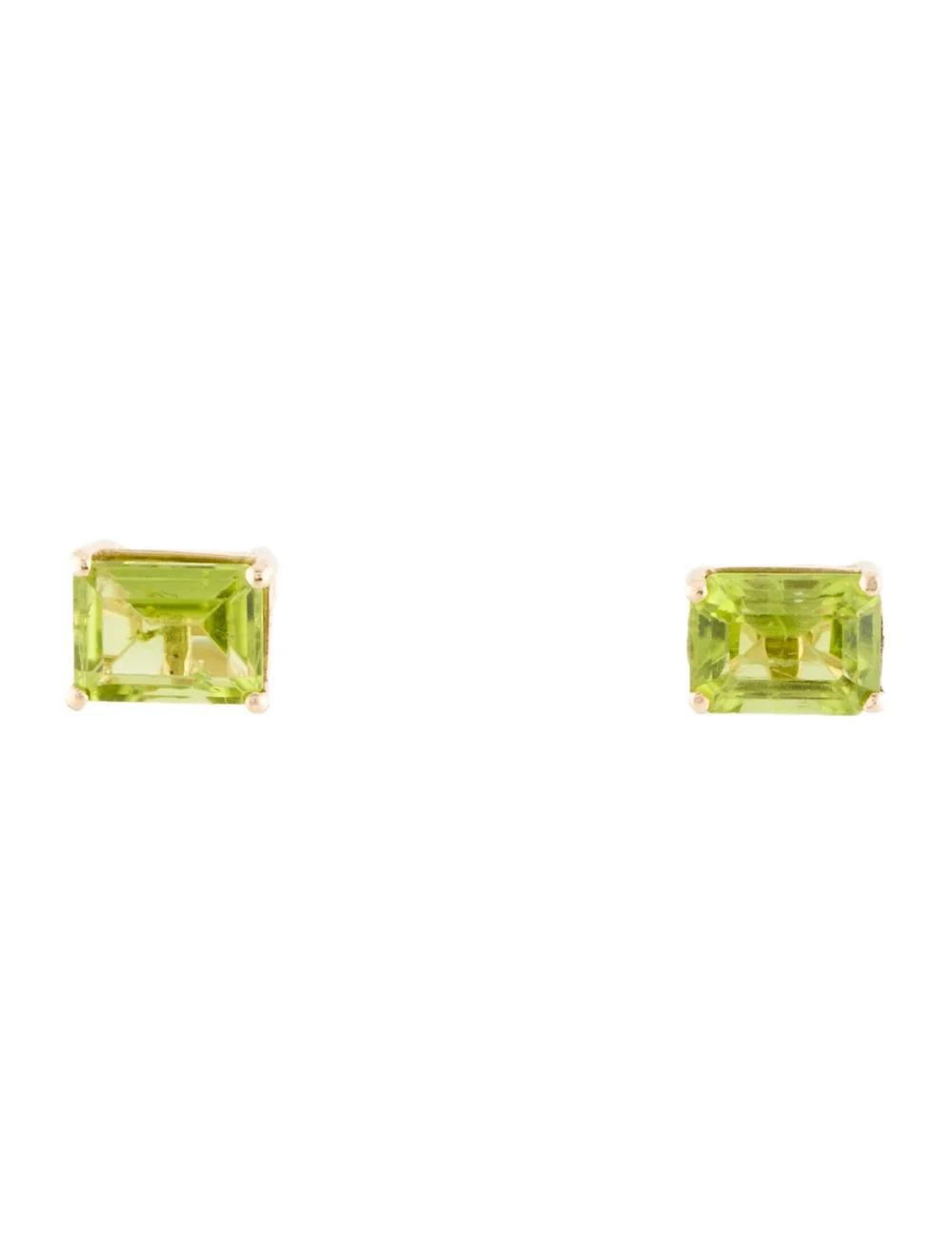 Elevate your style with these exquisite 14K Yellow Gold Peridot Stud Earrings, boasting a stunning 3.74 Carat Emerald Cut Peridot gemstone in each earring. The vibrant green hue of the peridot stones adds a touch of elegance and sophistication to