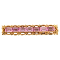 Brosche aus 14 Karat Roségold, besetzt mit einem rosa Saphir - 6,9 Gramm