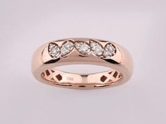 Bague bombée en or rose 14 carats, sertie de cinq grappes de diamants taille ronde disposées en zigzag