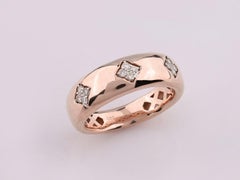 Bague bombée en or rose 14 carats, sertie de trois diamants taille ronde