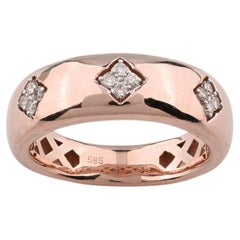 Bague bombée en or rose 14 carats, sertie de trois diamants taille ronde