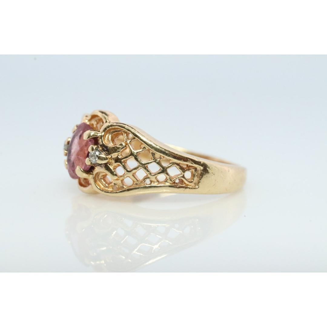 Vintage from the 1970s
Materials: Gold
Gemstone: Tourmaline
Gem color: Pink
Band color: Gold
Stunning TOURMALINE ring. Pink Tourmaline set into an 18k bezel and ribbed shank. Will work splendid as a pinkie ring.

Tourmaline has beautiful internal