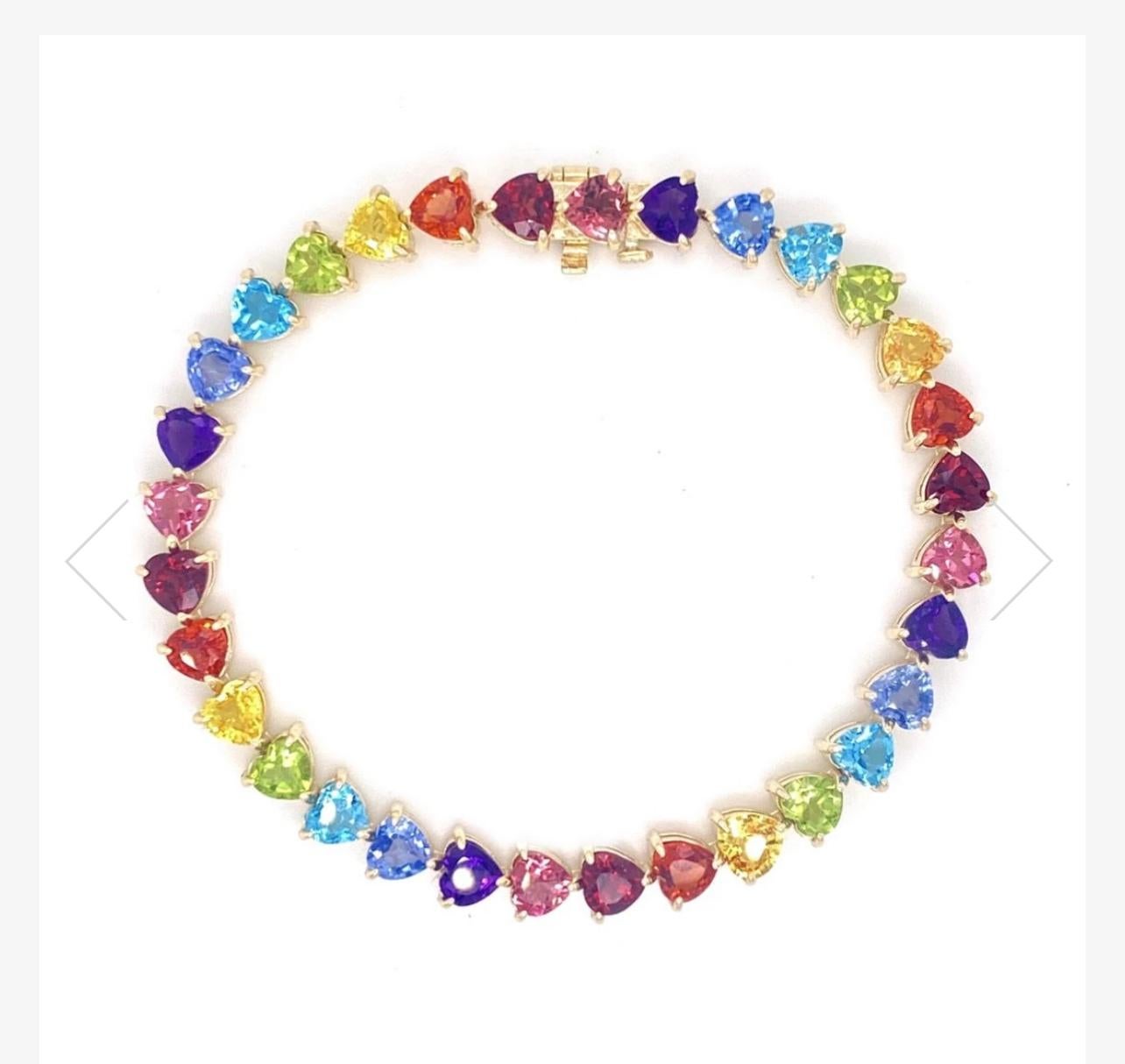 RAINBOW HEART TENNIS BRACELET

The full rainbow fantasy in the most unique and colorful bracelet to light up your life! This tennis bracelet is like no other consists of heart settings with colored gems and sapphires in the Classic Mordekai rainbow