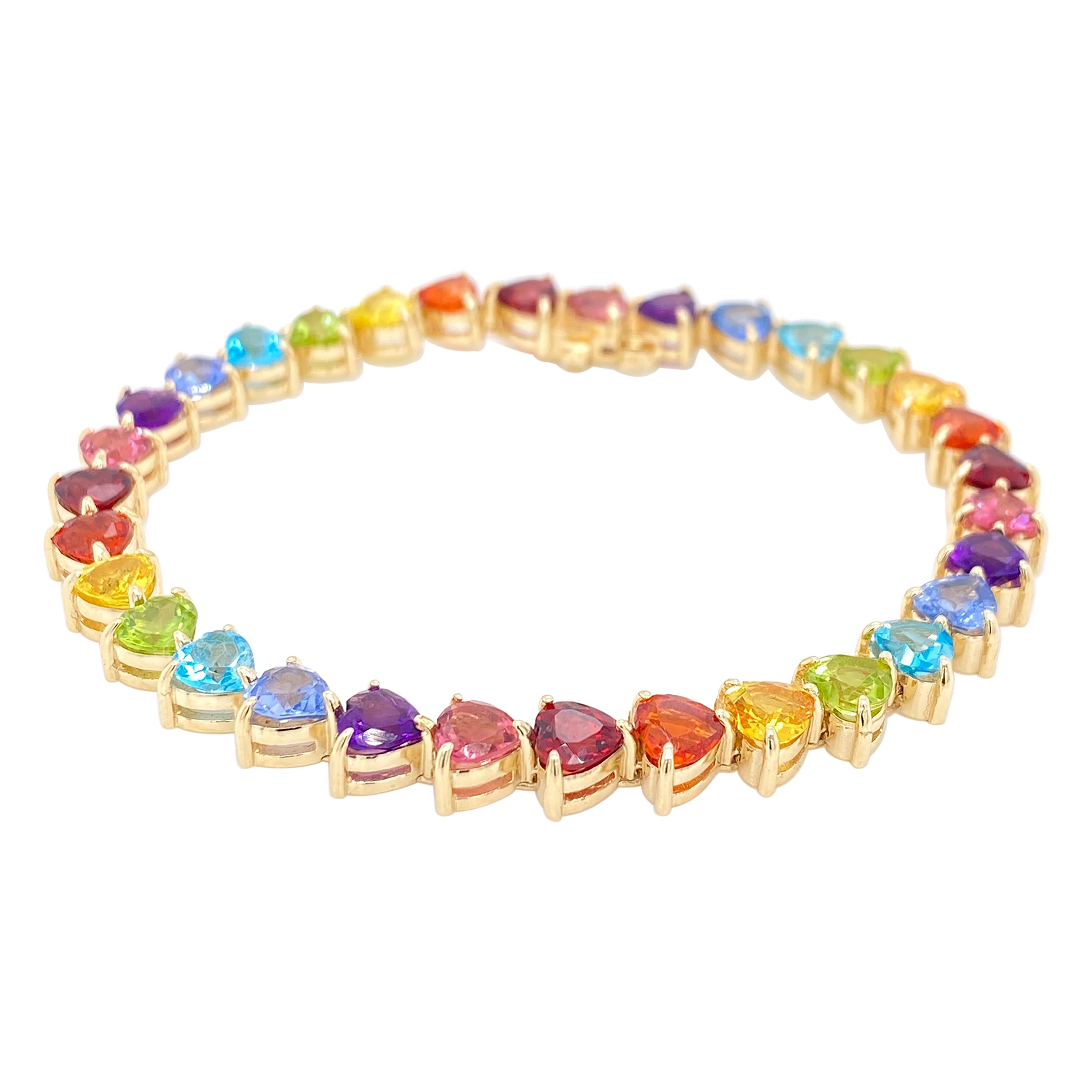 Pulsera de tenis con gemas arco iris de oro amarillo de 14 quilates en venta
