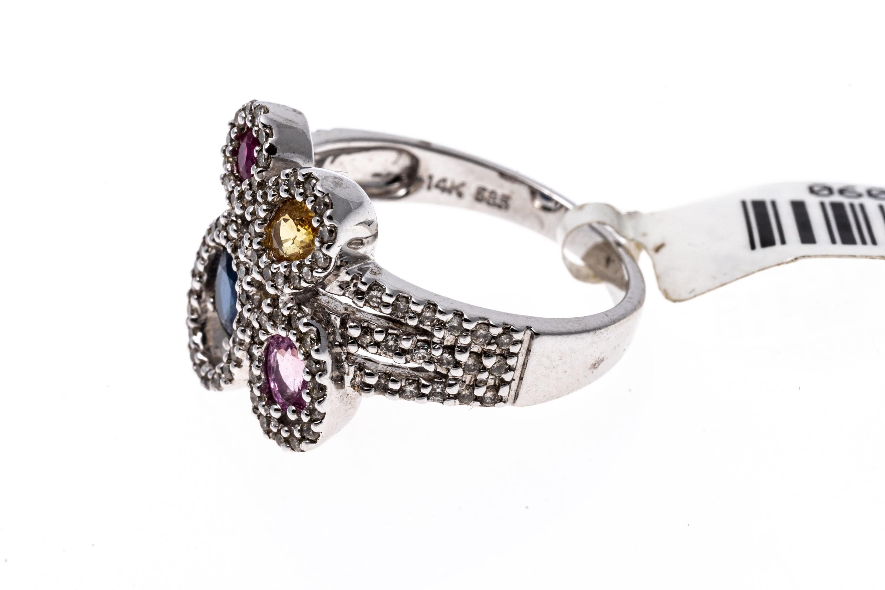14K Ring Of Diamonds And Colorful Sapphires
A unique and abstract design of colorful sapphires and diamonds set over a 14K white gold ring. This whimisical ring features oval cut blue, pink and yellow sapphire with a single round cut ruby, framing