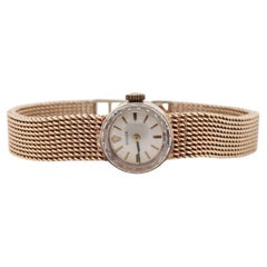14k Rolex Women's Cocktail Watch. 14k Orchid Rolex with Yellows Gold Bracelet.