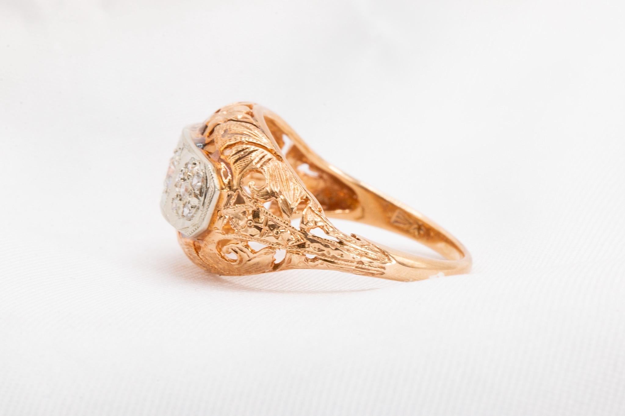 This exquisite vintage estate ring from the 1940s features a unique three-stone diamond design set in 14k rose and white gold. With approximately 0.25 carats total weight of natural, clean white diamonds, this piece is a timeless treasure for those