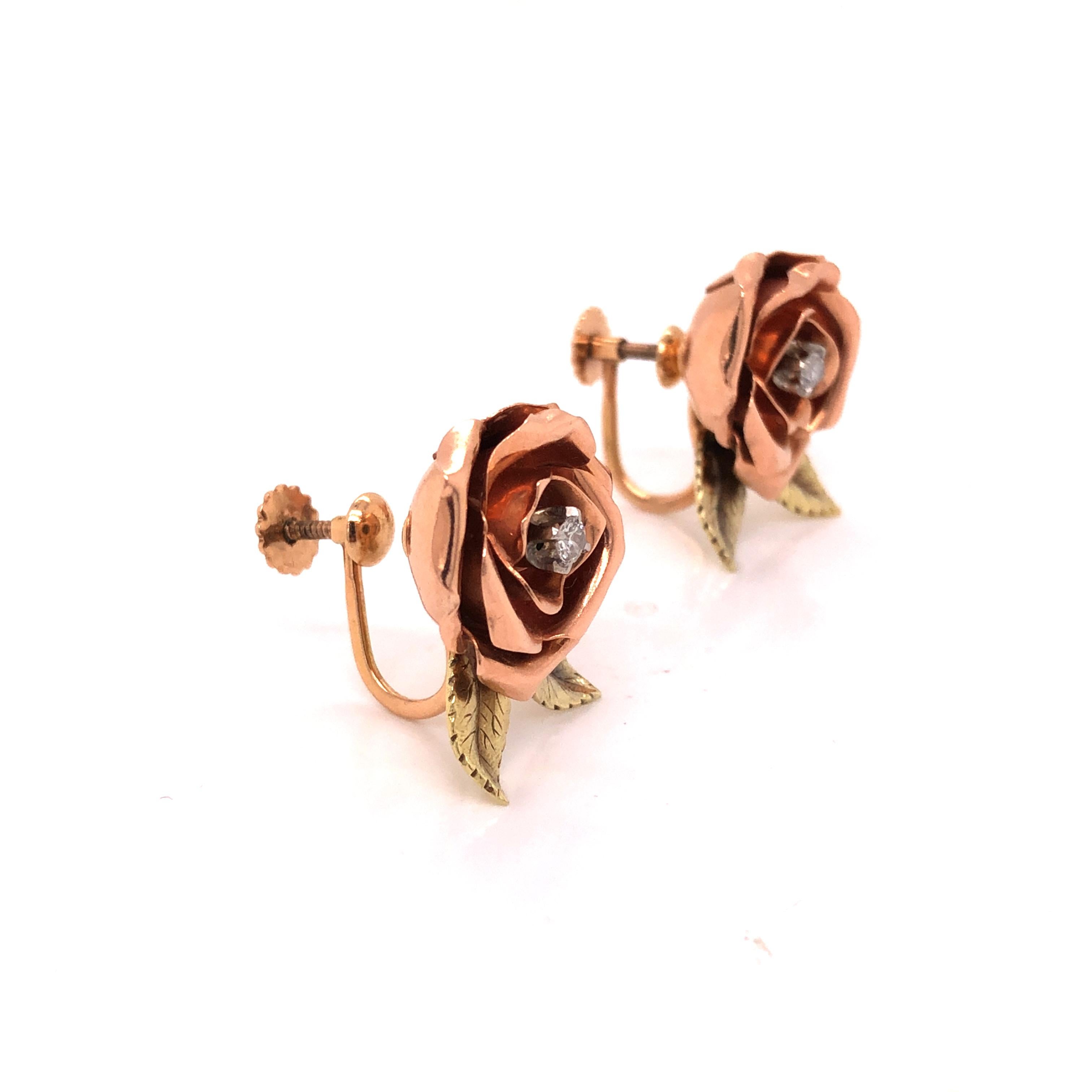 A lovely pair of vintage screw back 14K Rose and Yellow Gold Diamond Rose Earrings containing two round brilliant cut diamonds weighing approximately 0.13 carat total.

Weight: 7.9 grams
