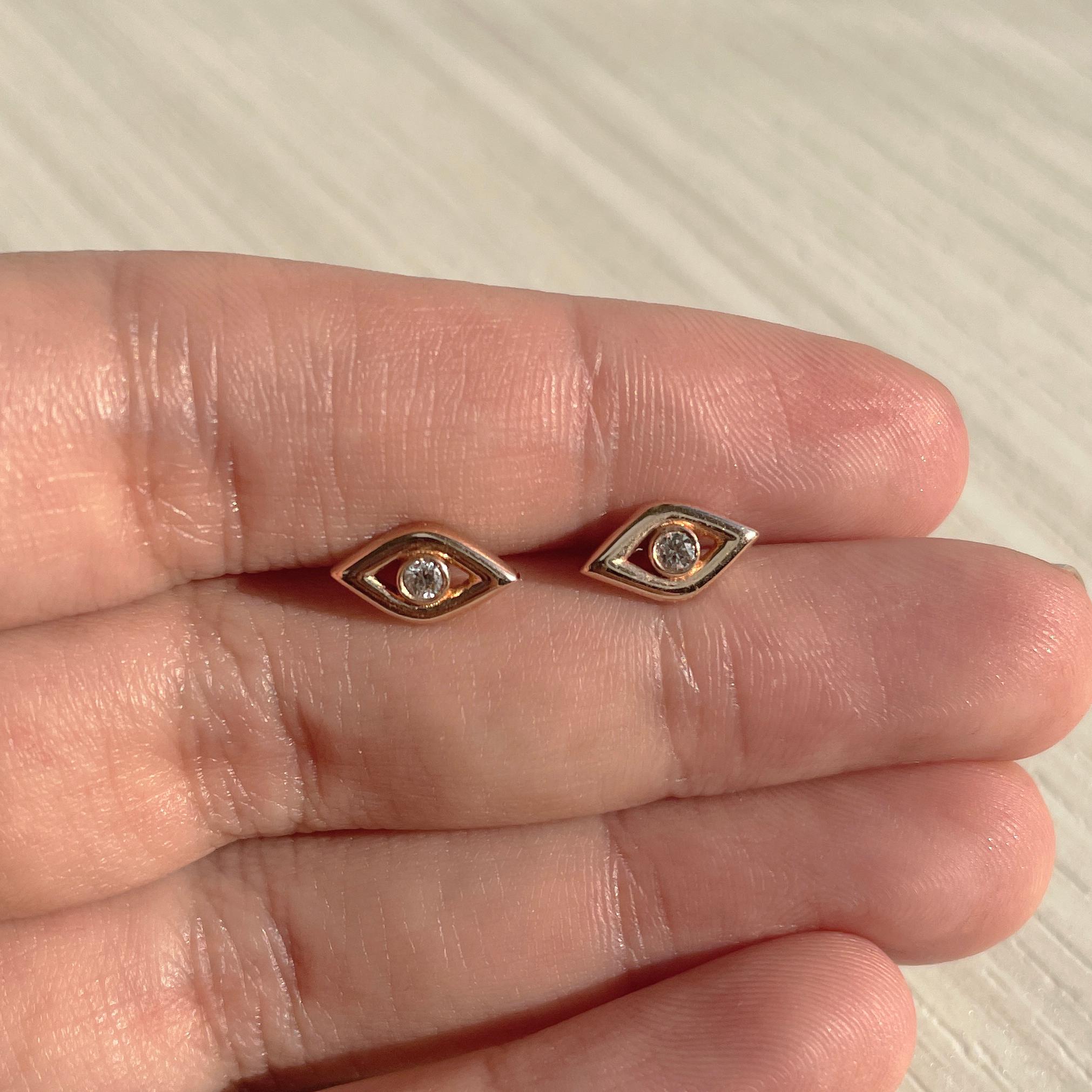 Show off your unique style with these striking Evil Eye Studs earrings. The earrings are crafted in 14k gold and feature approximately 0.07 ct. of genuine white diamonds. The earrings are secured with butterfly backs.  Diamond color and Clarity GH
