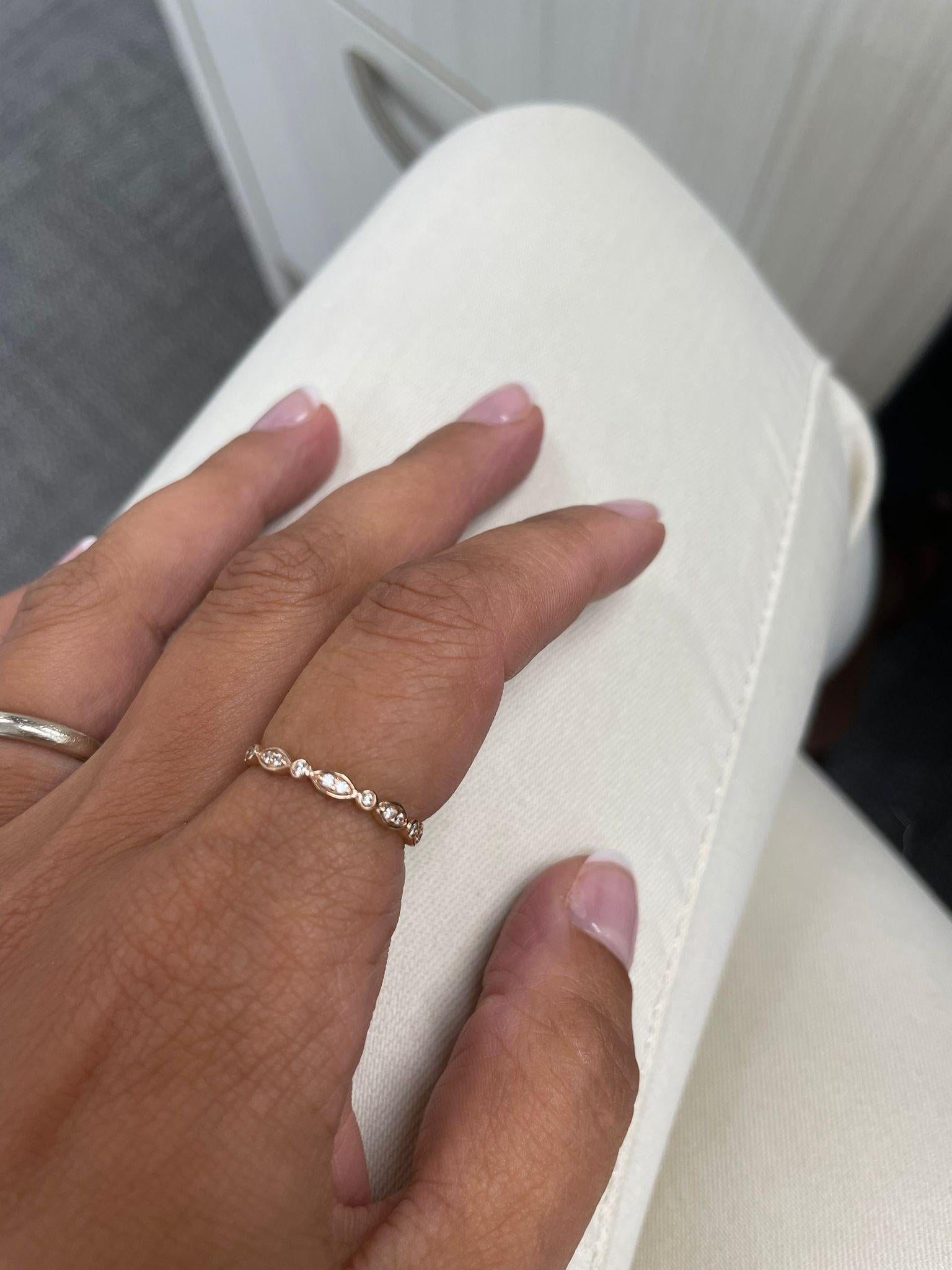Charming and Elusive Design - This stackable ring features a 14k gold band, and round diamonds approximately 0.10 cts, with a diamond color & clarity of GH-SI1.
 Measurements for ring size: The finger Size of the ring is 6.5 and your jeweler can