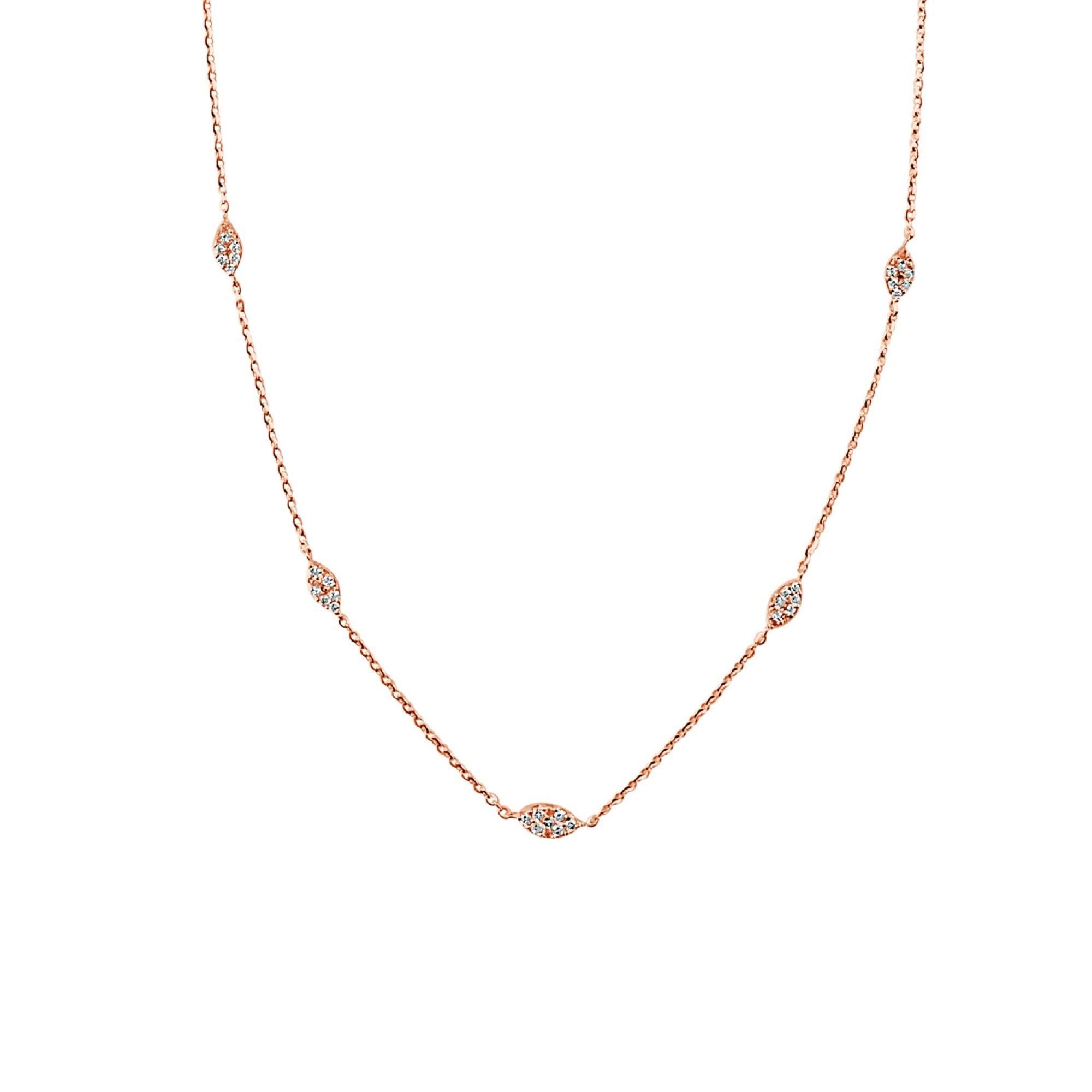 Graceful marquise shaped stations of diamonds set in 14k gold with cable chains between each form this lovely necklace for her. The 18-inch necklace has a total diamond weight of approximately 0.30 carat, and secures with a lobster clasp. Diamond