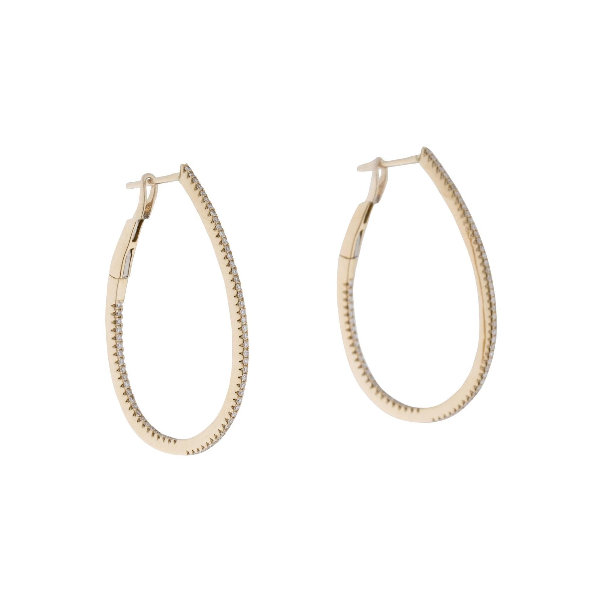 Set your lobes aglow in the classic shimmer and shine of these luxurious pear shape skinny hoop earrings! A dazzling array of diamonds fire up and down the design crafted from 14k white or yellow gold. Lever backs offer easy application so you can