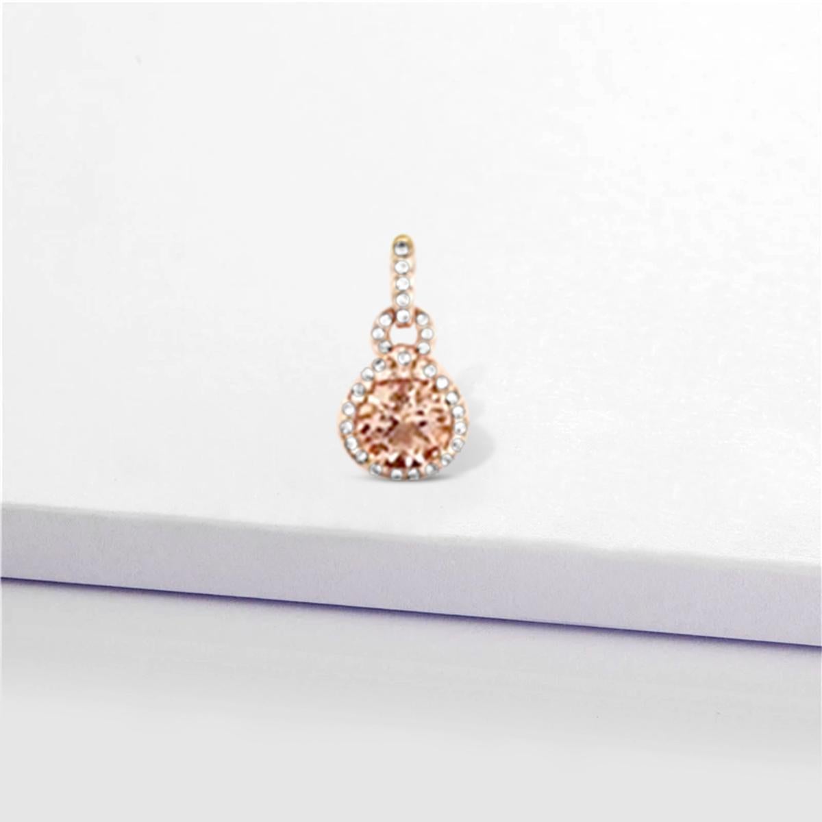 Fine Quality 14K Rose Gold Pendant Features 7mm Round Cut Morganite Stone Sits Nestled Among A Halo Of Diamonds Leaves A Lasting Impression. This Elegant Piece of Morganite Pendant is Best for your Fancy Events.

Style# TS1127MOP
Morganite: Round