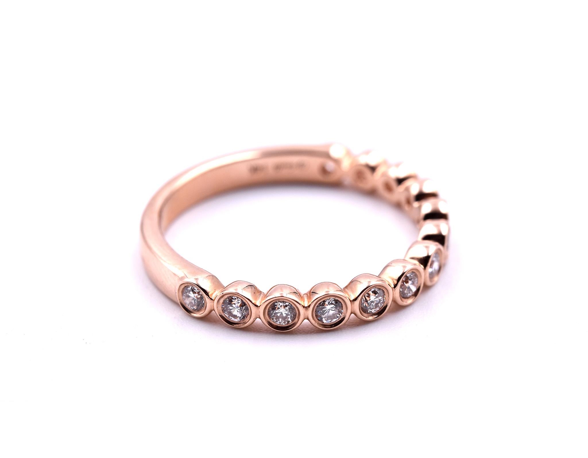 Designer: custom design
Material: 14k rose gold
Diamonds: 13 round brilliant cut = .36cttw
Color: G
Clarity: VS
Ring size: 6 ½ (please allow two additional shipping days for sizing requests)
Dimensions: ring is approximately 2.74mm wide
Weight: 2.53