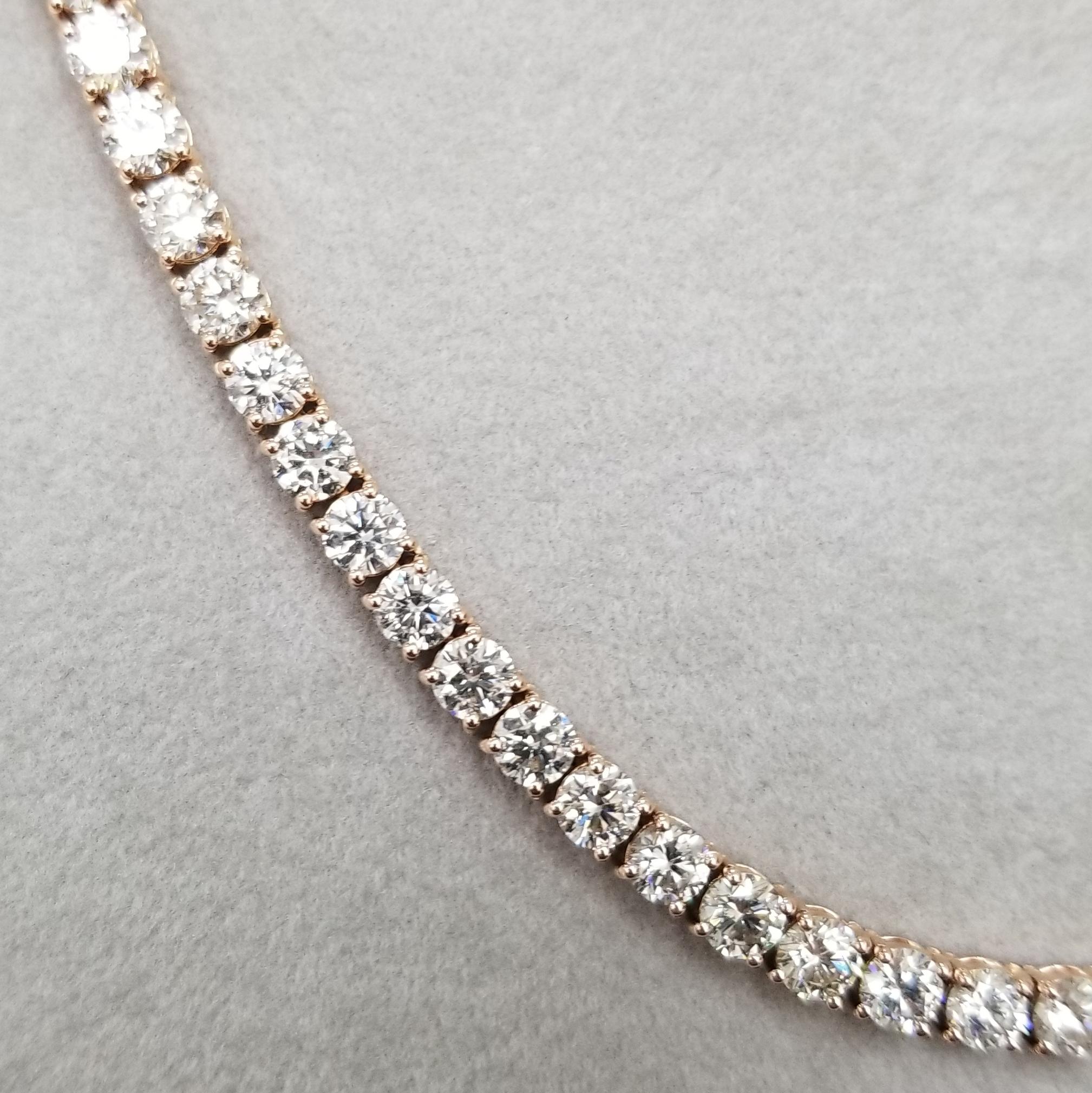 14k rose gold 4 prong diamond necklace, containing 
 Specifications:
    main stone: ROUND CUT DIAMONDS
    diamonds: 94 PIECES
    carat total weight: 24.98cts.
    center diamond:  4.1mm
    color: H
    clarity: VS2
    brand: custom
    metal: 