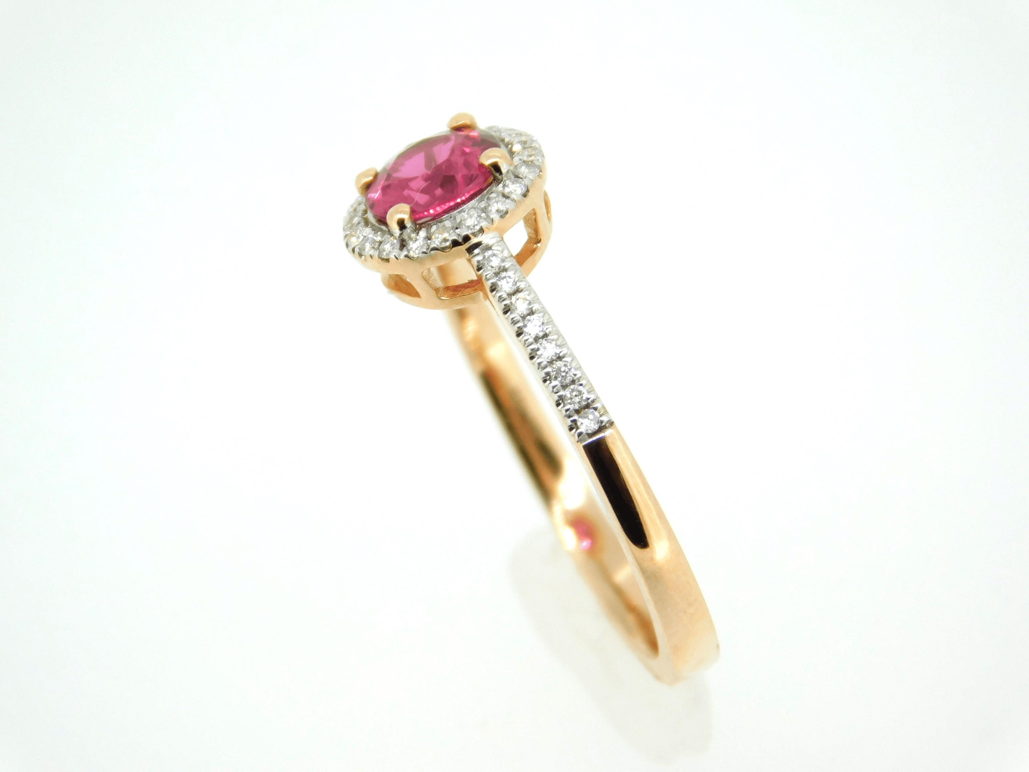 14k Rose Gold .72ct Pink Genuine Natural Sapphire Ring with Diamond Halo #J4450

14k rose gold pink sapphire ring with diamond halo. The pink is a very bright intense color. The sapphire weighs .72cts and measures 5.5mm. There is a halo of diamonds