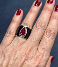 14k rose gold and black enamel ring with an approximately 3 carat natural ruby