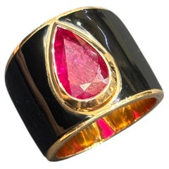 14k rose gold and black enamel ring with an approximately 3 carat natural ruby