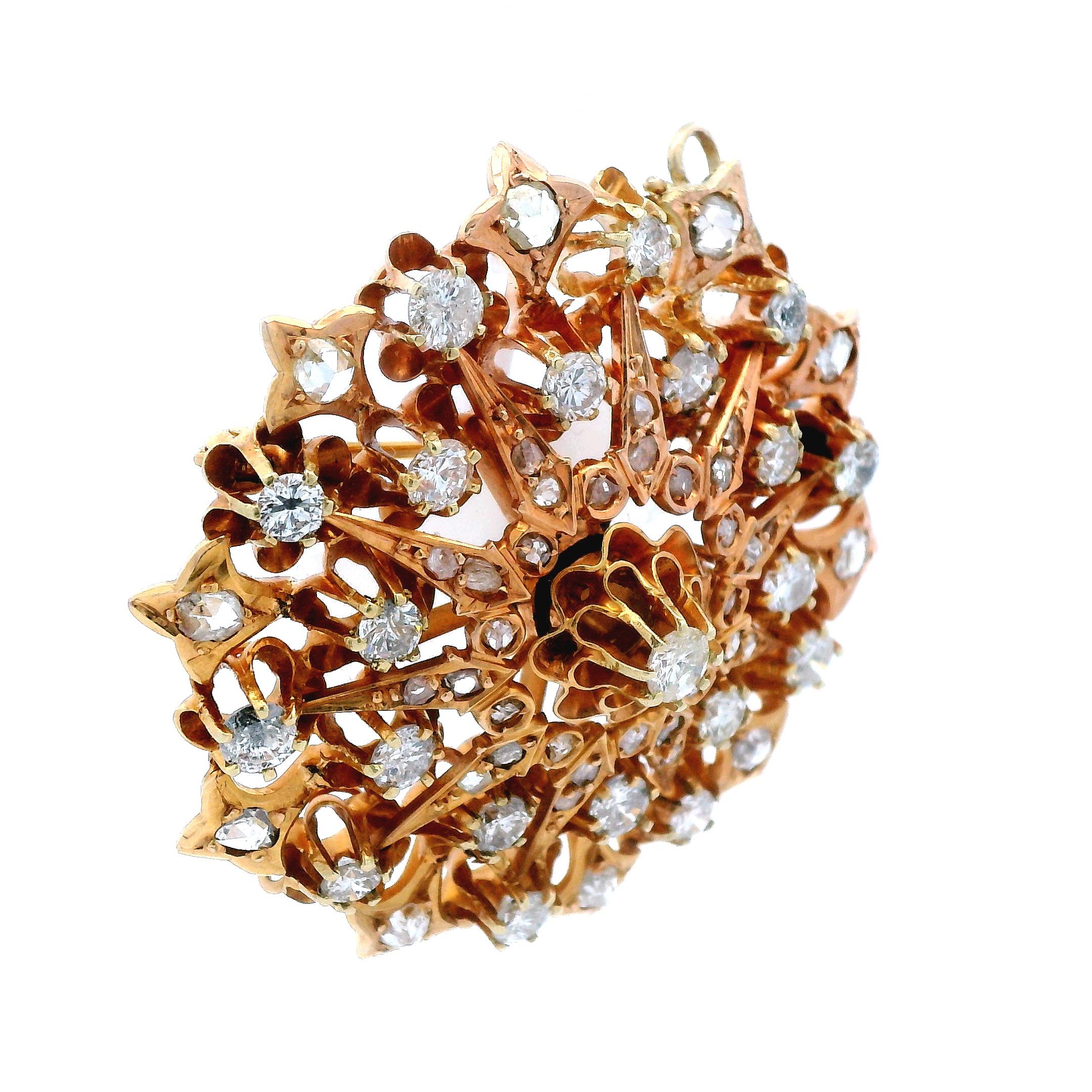 This stunning pin/pendant is made in 14k rose gold and features round and rose cut diamonds. This pin is unique due to its design and quality craftsmanship, but also for it’s ability to be worn as both a pin or a pendant. With over 5.5 carats of