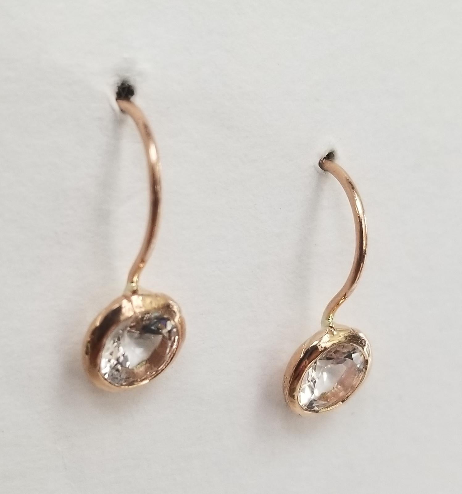 14k rose gold aqua marine bezel set earrings, containing 2 round aqua marine.