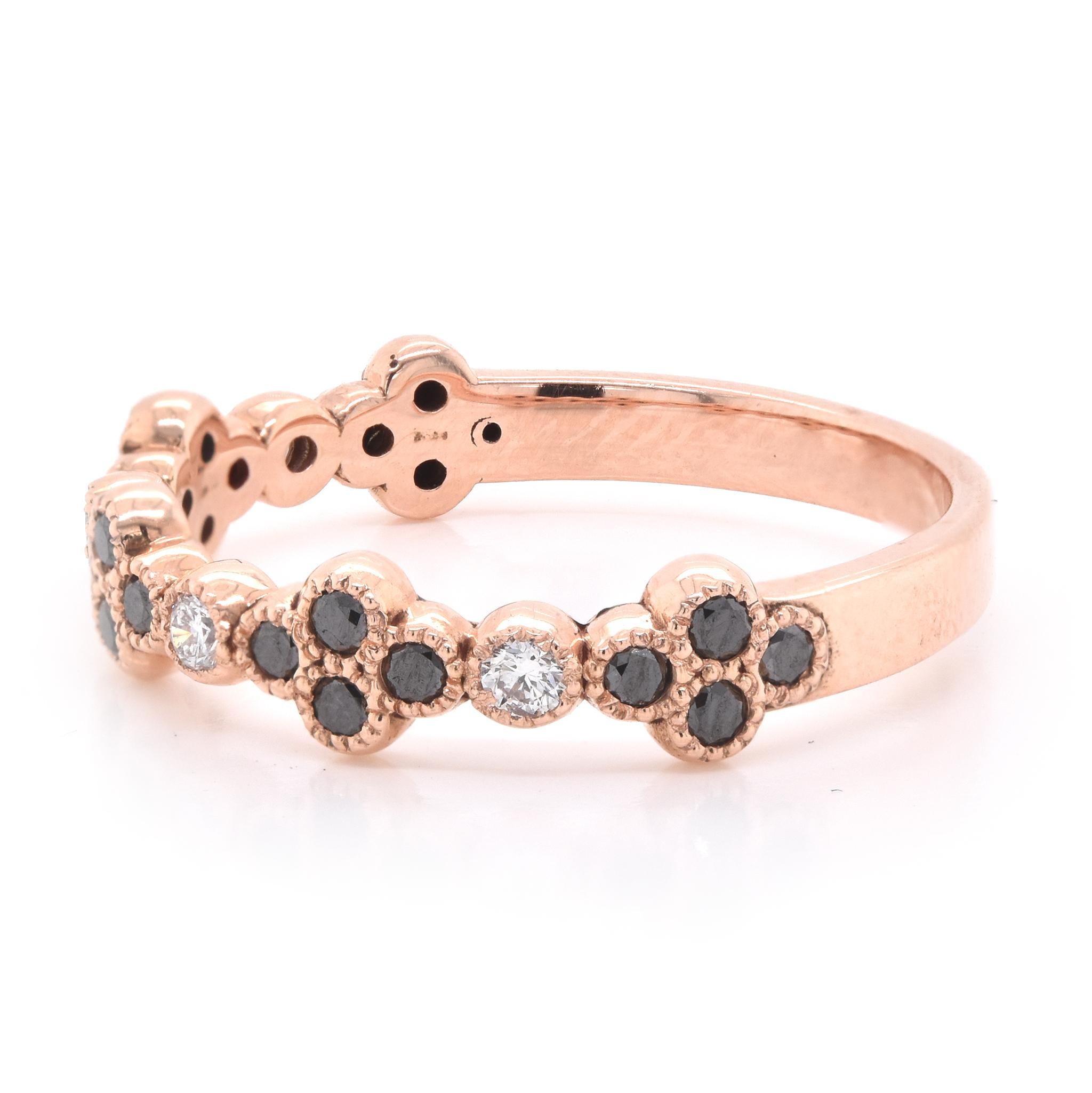 Material: 14k rose gold
White Diamonds: round brilliant cuts = 0.10cttw
Black Diamonds: round brilliant cuts = 0.27cttw 
Size: 6 ¾ 
Dimensions: ring measures 2.45mm in width
Weight: 2.38 grams
