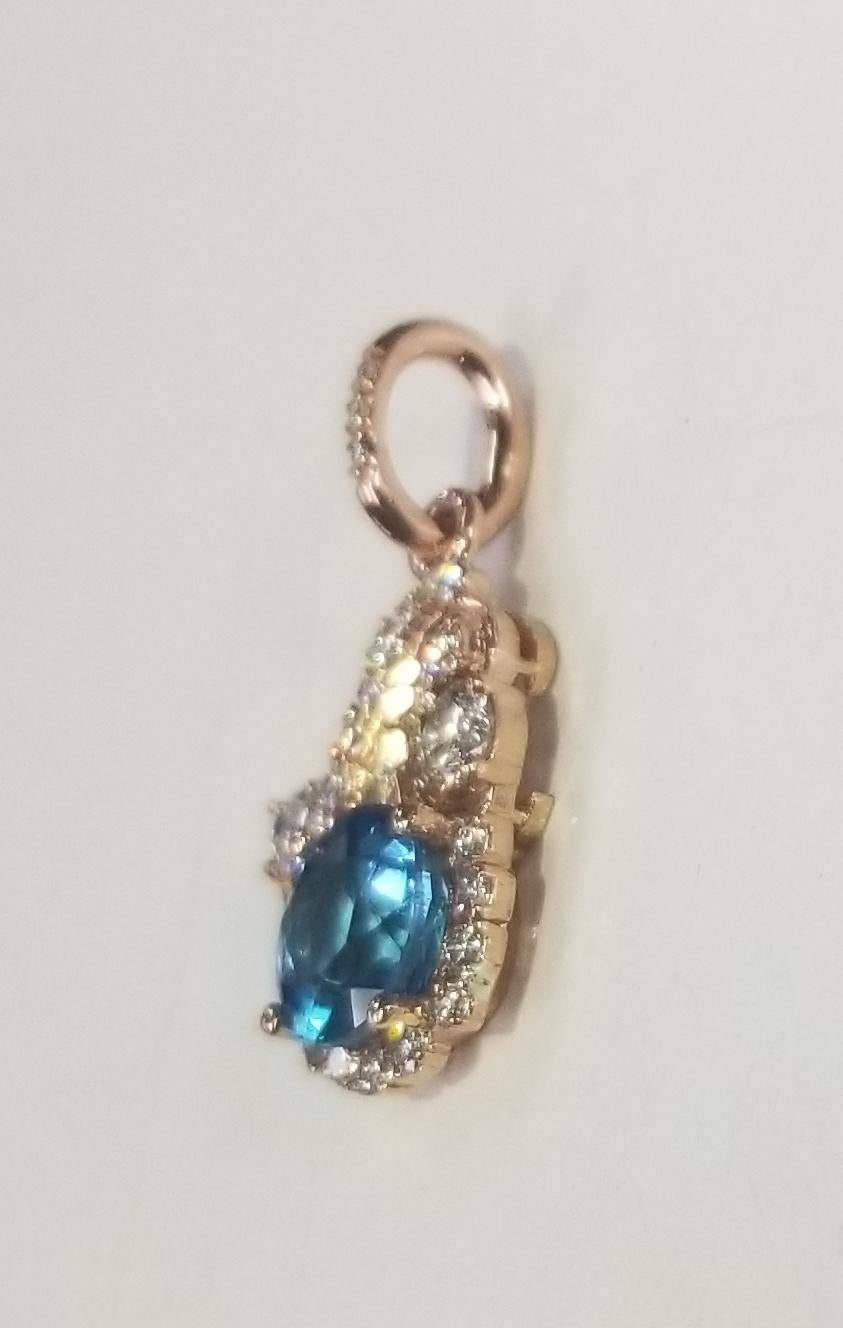 Contemporary 14 Karat Rose Gold Blue Topaz and Diamond Pendant For Sale