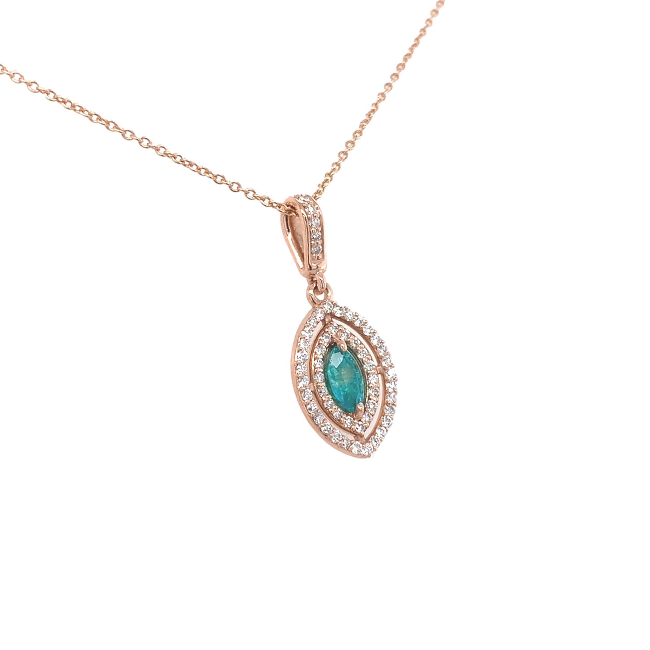 14K rose gold paraiba tourmaline and diamond pendant. The natural earth mined tourmaline has a report from the Stone Group Laboratories #190820U-RSN stating Brazilian origin. The marquise shaped tourmaline measures 5.91mm x 2.98mm x 1.76mm and