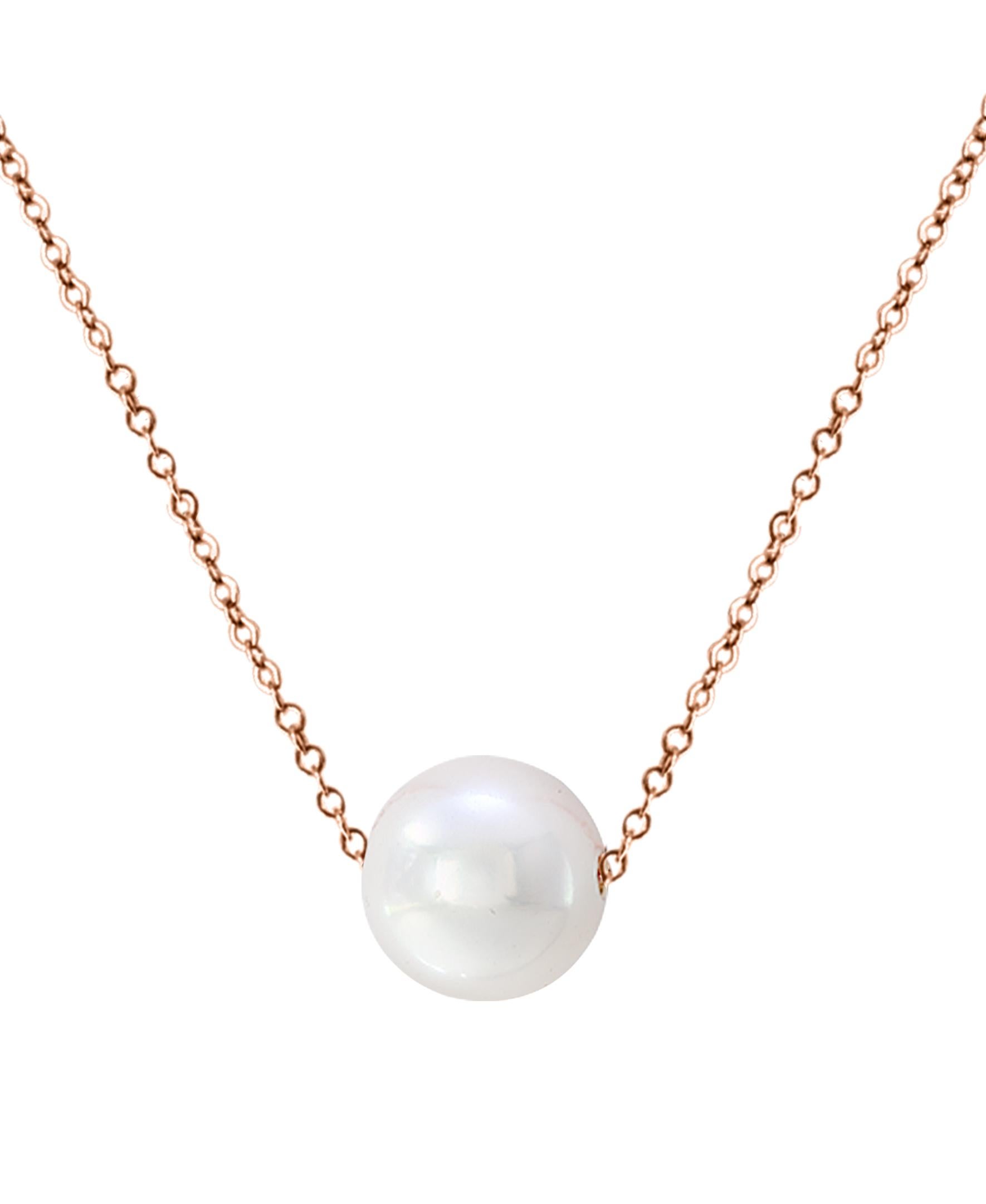 This simple yet elegant pendant features a beautiful, intense, natural-colored, round Freshwater white cultured pearl on a 14 karat Rose gold adjustable length chain. The pearl measures 9-10mm and the chain can be adjusted to as long as 18
