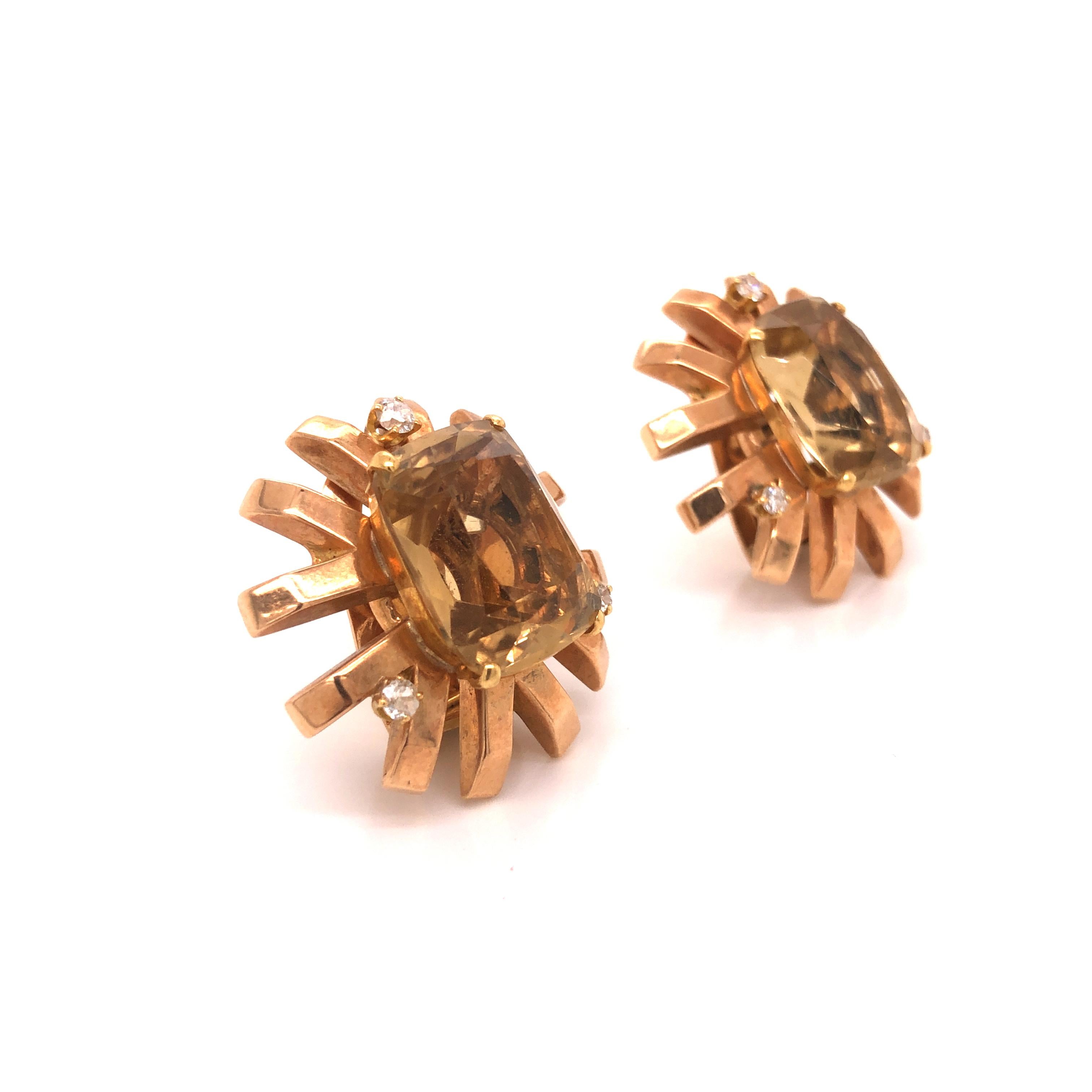 A vintage pair of 14K rose gold earrings featuring 2 cushion-cut citrine measuring 16.81 x 12.73 x 9.01 mm and weighing a total of approximately 21.70 carats, enhanced by full-cut diamonds weighing a total of approximately .30 carat, G-H-I color, I
