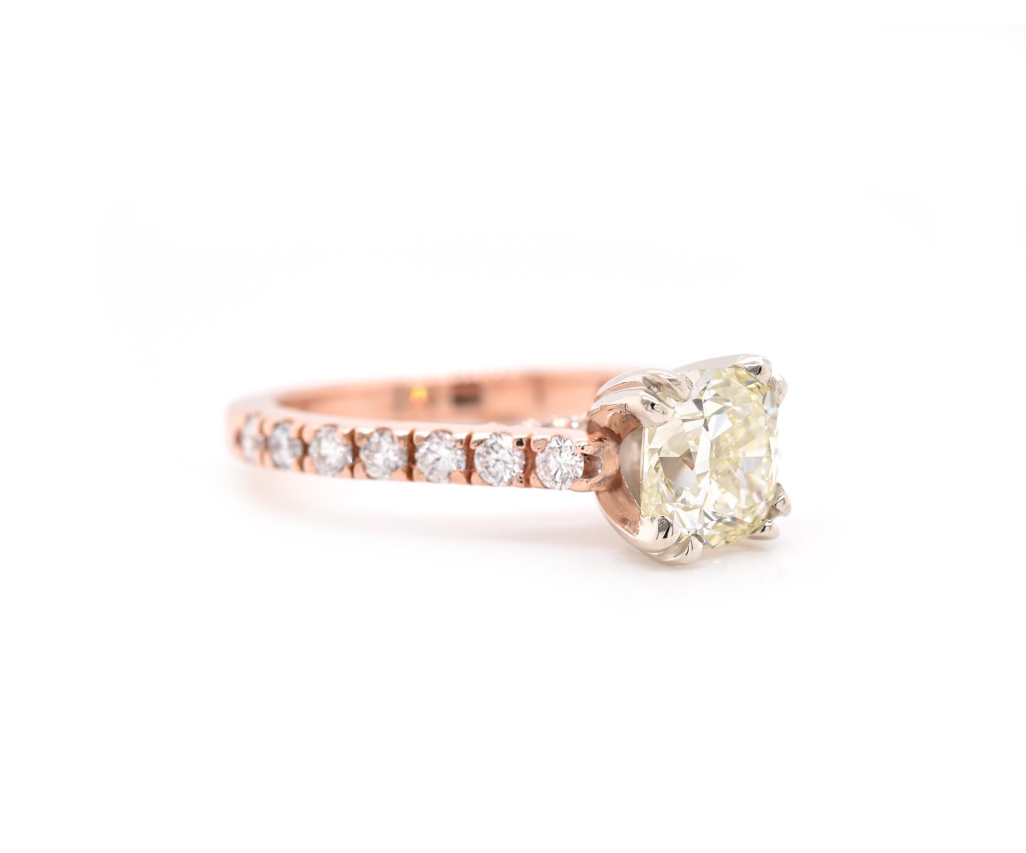 Designer: custom design
Material: 14k rose gold
Center Diamond: 1 cushion cut = 1.51ct
Color: O-P
Clarity: VVS2
GIA Certificate: 1206539939
Mounting Diamonds: 28 round brilliant cuts 
Ring Size: 5 (please allow two additional shipping days for