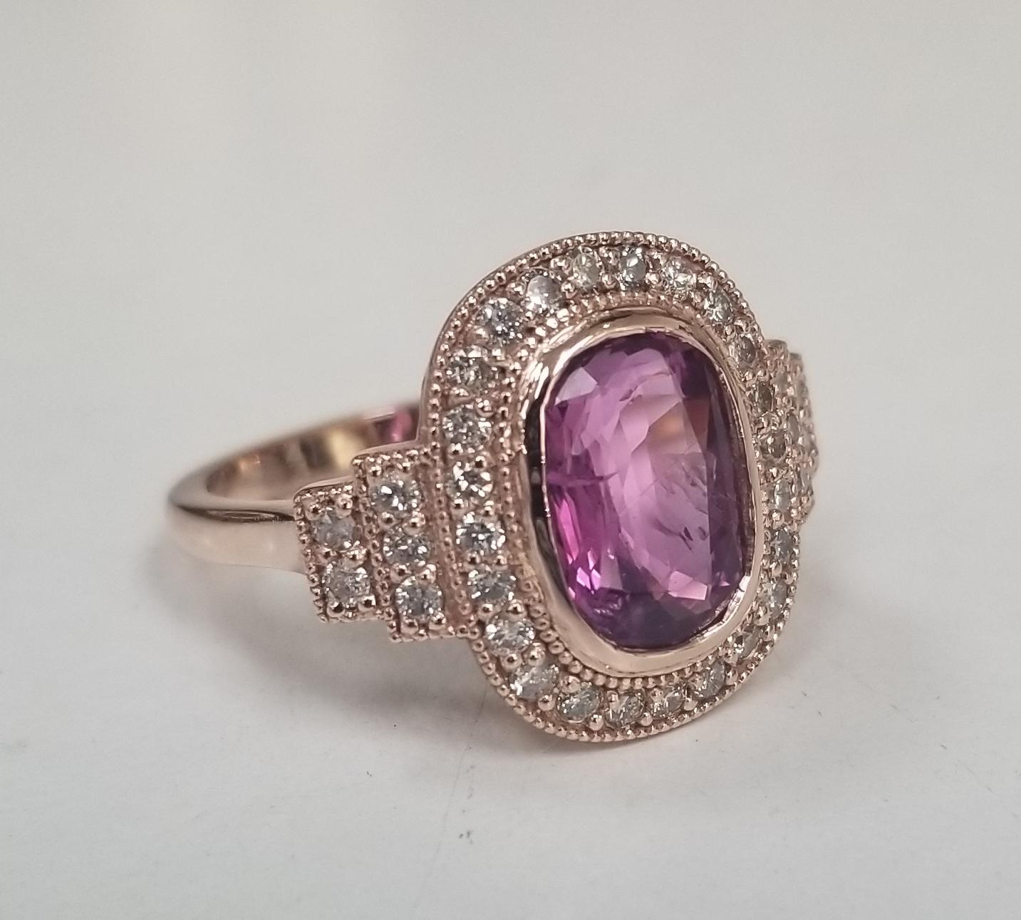 Diamond Specifications
Main Stone: Pink Tourmaline 3.20cts.
Additional Stones:Round diamonds                              
Carat Total Weight:   .65ctw
Color:   G
Clarity:   VS1-SI1
Jewelry Specifications
Brand:Custom
Metal: 14k rose gold
Type:
