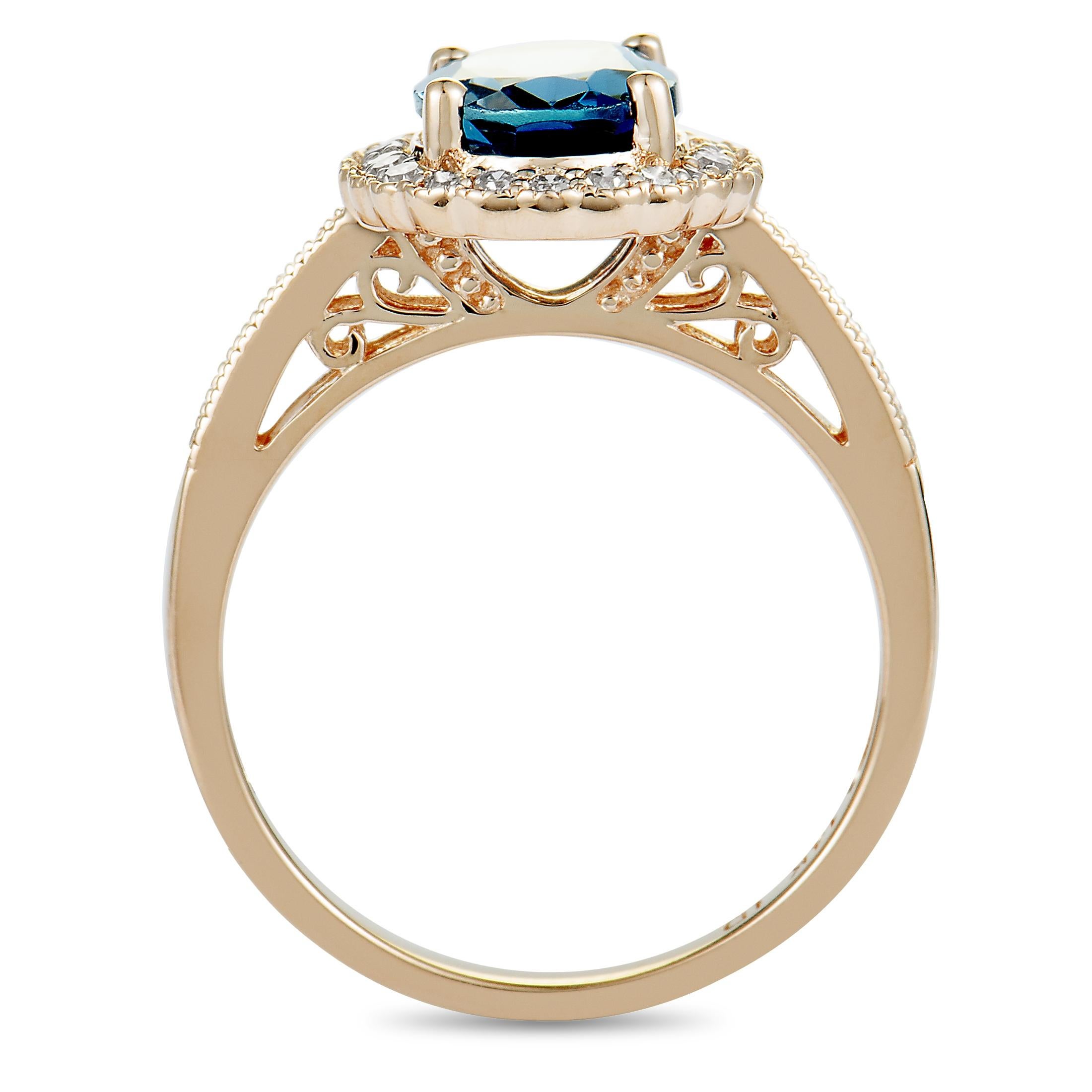 This ring is crafted from 14K rose gold and weighs 3.4 grams. It is set with a London topaz and a total of 0.15 carats of diamonds. The ring boasts band thickness of 2 mm and top height of 7 mm, with top dimensions measuring 20 by 12 mm.
 
 Offered