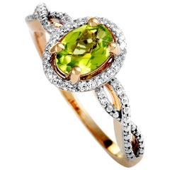 14 Karat Rose Gold Diamond and Peridot Oval Ring