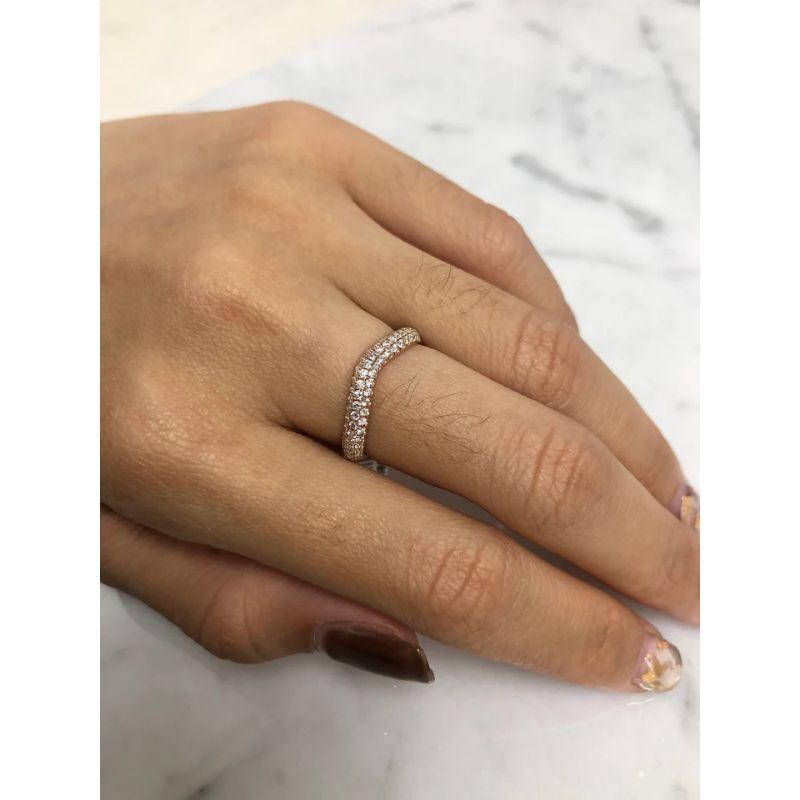 This beautiful ring is set in 14K Rose Gold with a slight curve to it.

It has a pave setting with 3 rows of round brilliant cut diamonds weighing 1.14ctw.

 The size is currently 6.5 and can be resized to fit. 
