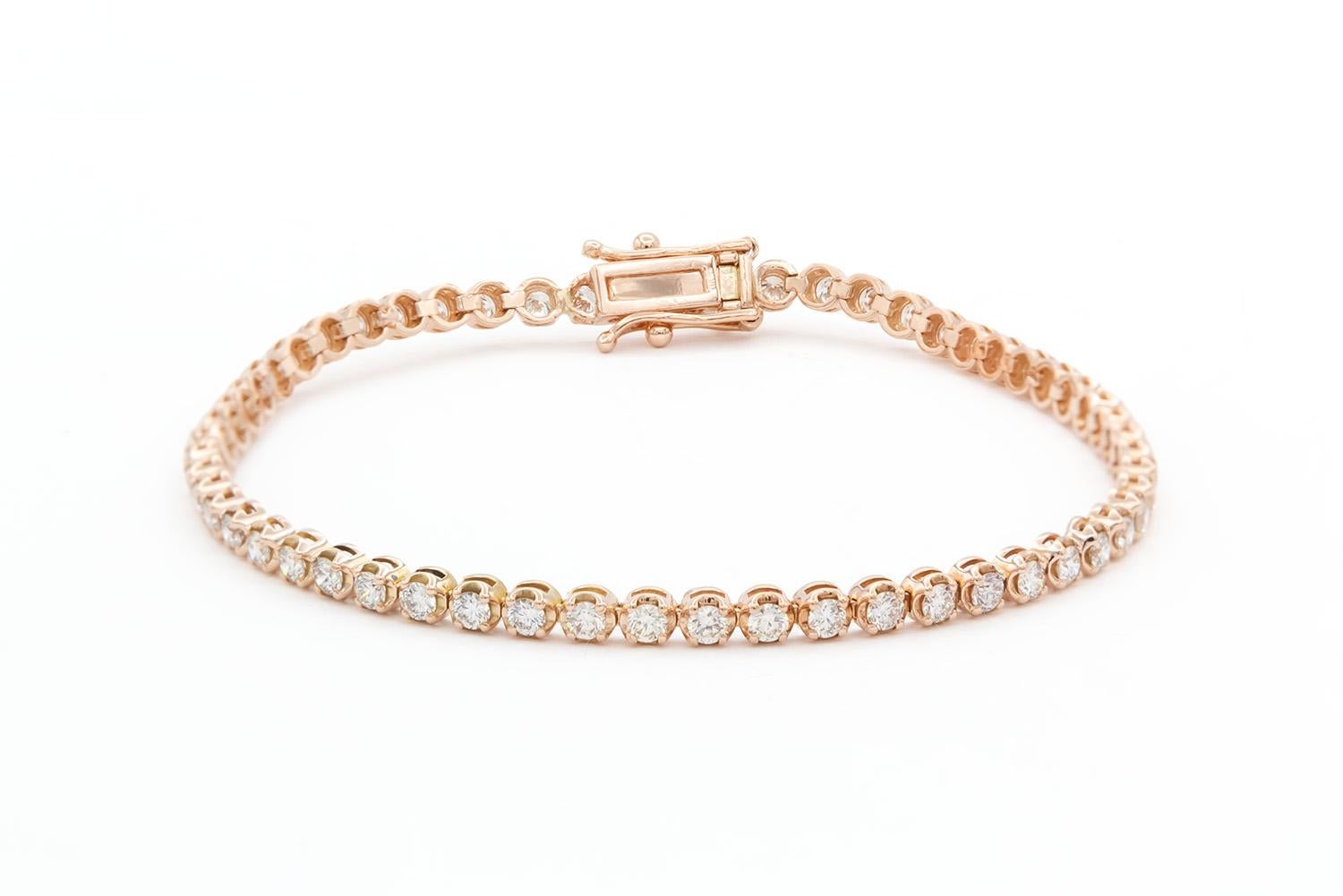 We are pleased to present this beautiful 14k Rose Gold & Diamond Tennis Bracelet . It features 56 round brilliant cut diamonds, each one approximately 0.03ct is size. The total carat weight of the bracelet is approximately 1.68ctw and the diamonds