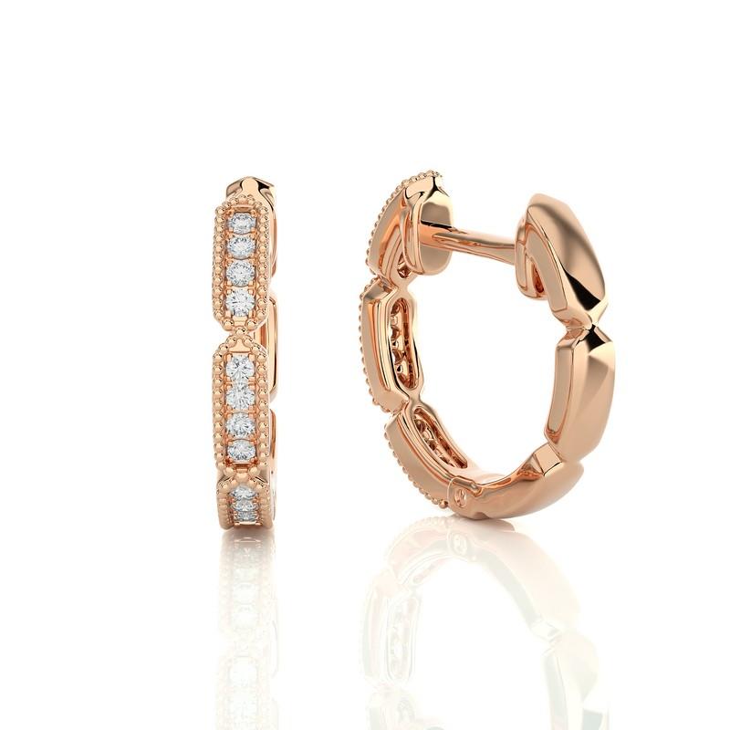 Indulge in understated luxury with our 14K Rose Gold Diamonds Huggie Earrings, each adorned with 24 dazzling diamonds totaling 0.1 carats. These elegant huggie earrings embrace your earlobes in a modern design, blending comfort with sophistication.