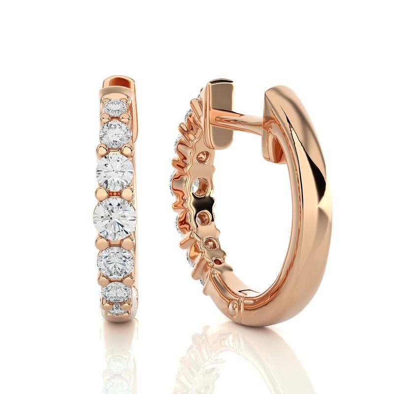 Adorn yourself with our 14K Rose Gold Diamonds Huggie Earring, showcasing a radiant 0.35 CTW of brilliant diamonds in a secure prong setting. Crafted in the warm embrace of rose gold, this huggie-style earring offers both comfort and elegance. Its
