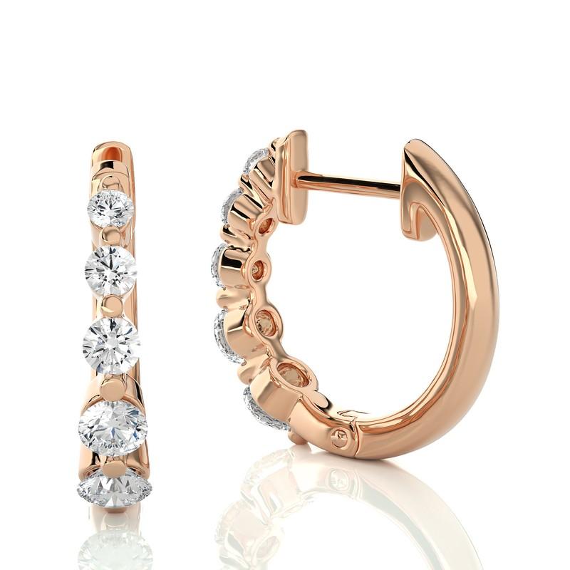 Elevate your jewelry collection with our 14K Rose Gold Diamonds Huggie Earrings, featuring a total of 0.45 carats and adorned with ten exquisite diamonds. These huggie earrings combine classic elegance with a touch of contemporary flair.

Crafted