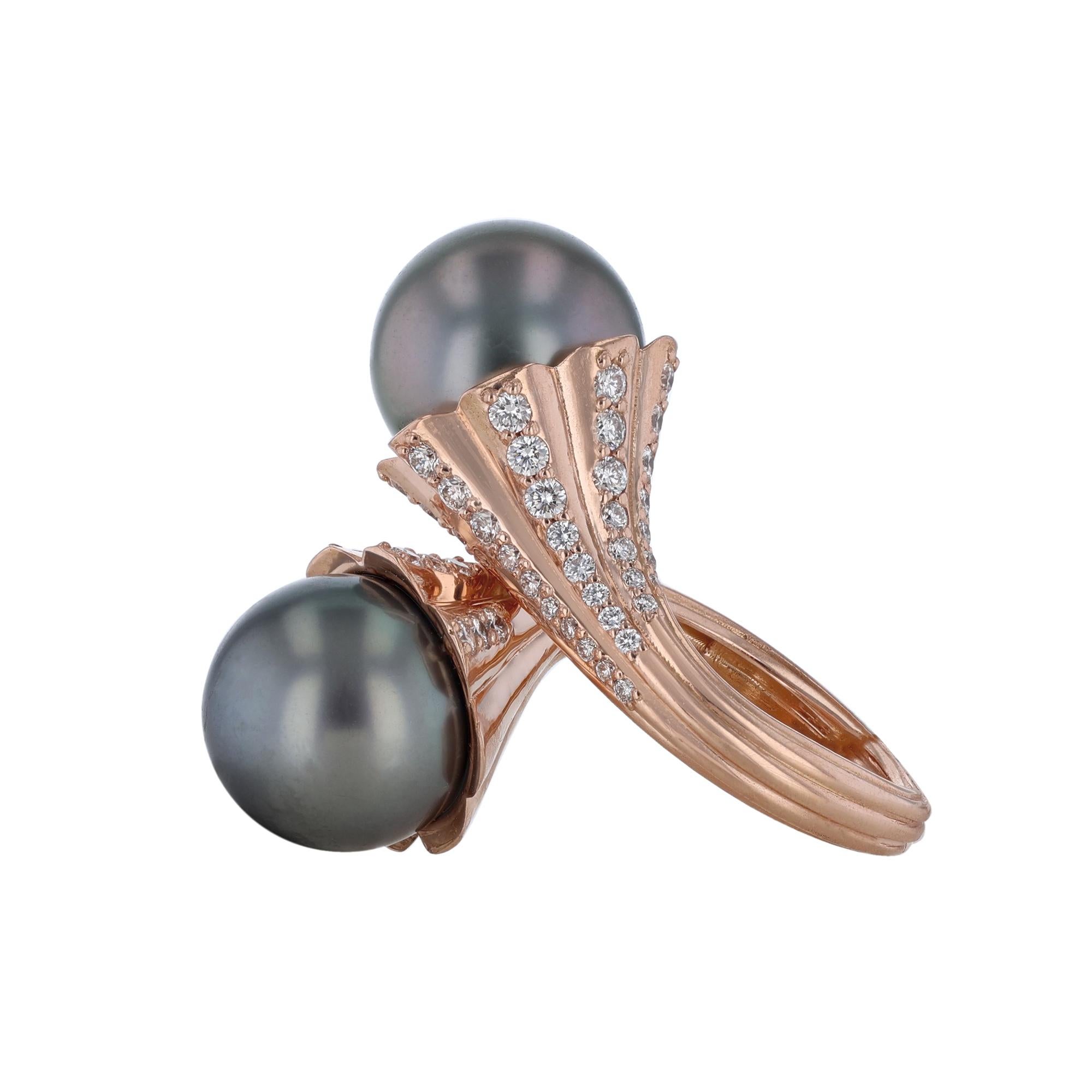 This ring is made in 14K rose gold and features two 13.50 and 14 millimeter Tahitian Pearls with 76 round cut diamonds weighing 1.47 carats. With a color grade H and a clarity grade SI2.