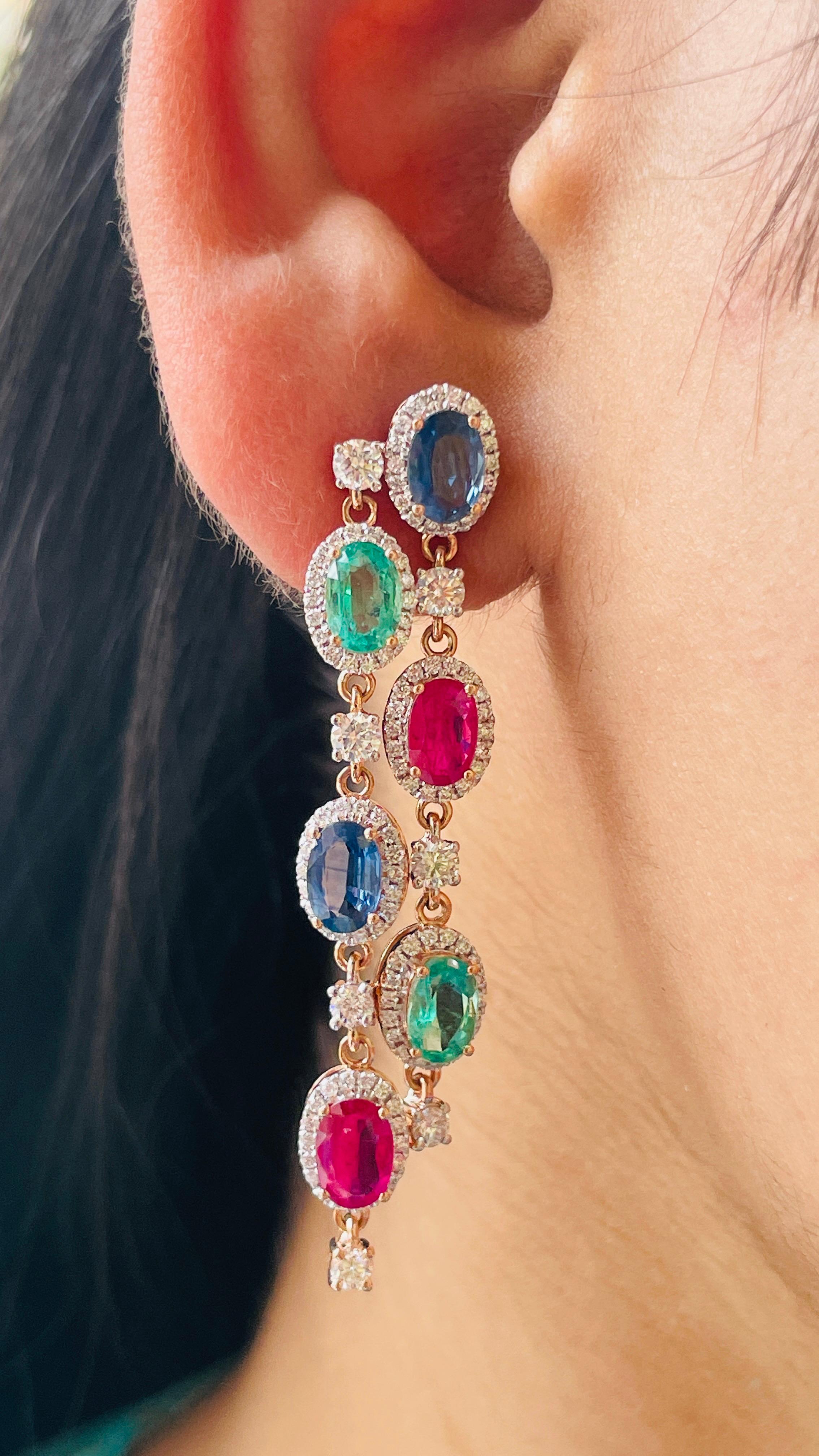Emerald, Ruby and Blue Sapphire Dangle earrings with diamonds to make a statement with your look. These earrings create a sparkling, luxurious look featuring oval cut gemstone.
If you love to gravitate towards unique styles, this piece of jewelry is
