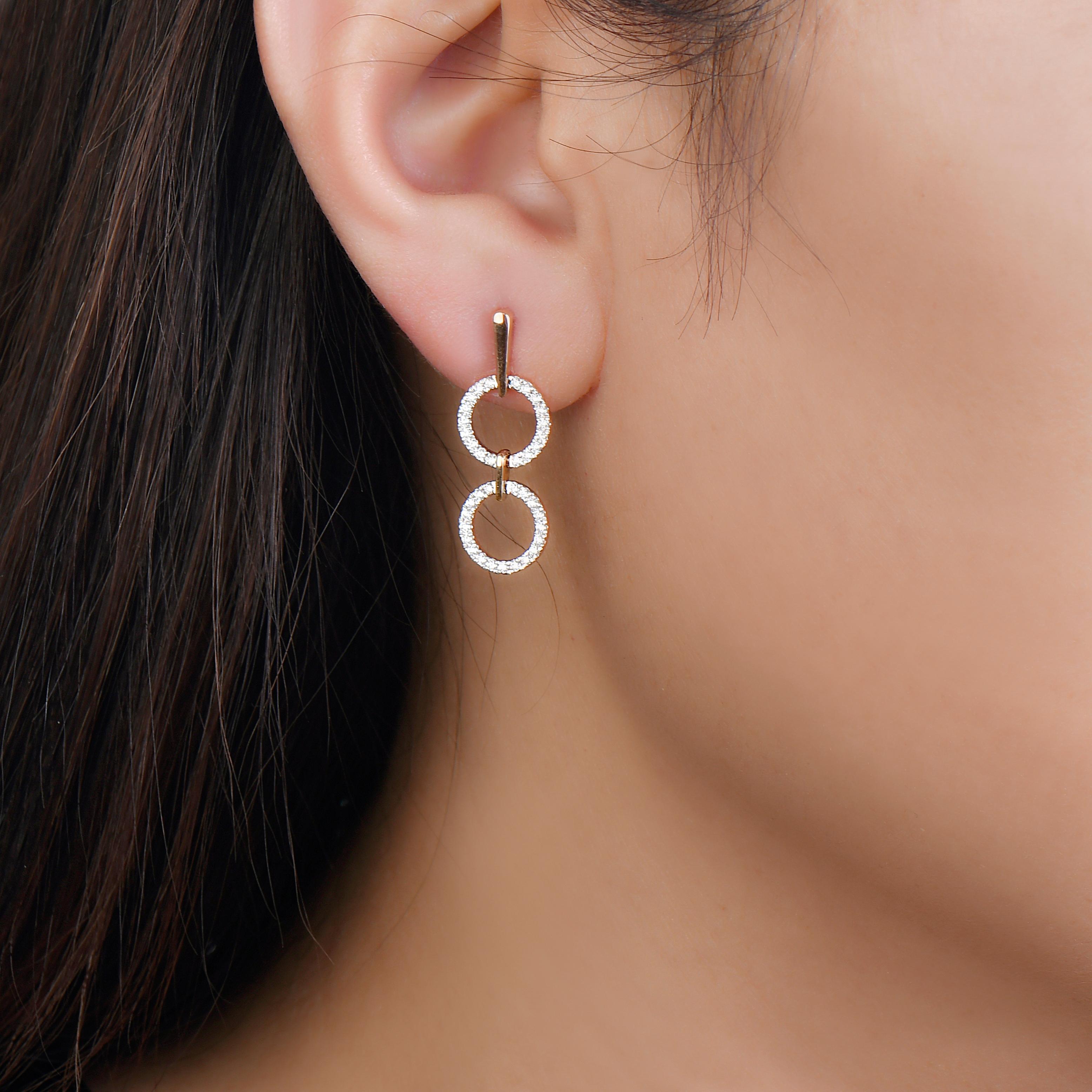 A different take on dangling earrings, these geo art earrings have more of a hang than a dangle. However, that does not make them any less stunning. The diamond dangling earrings in 14K rose gold are perfect to gift someone you share a special